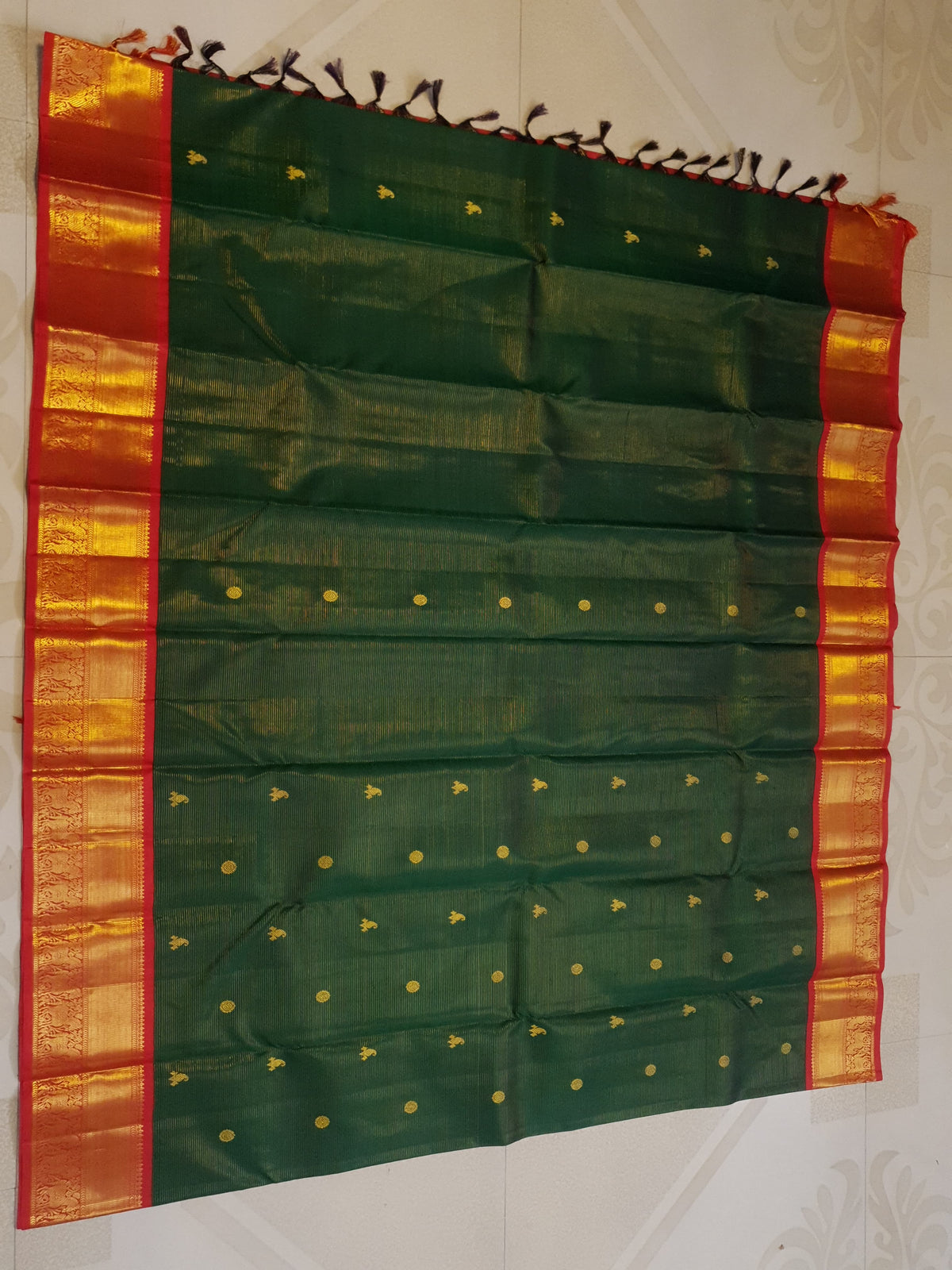 Bottle Green Kanchipuram Handloom 2G Gold Vairaoosi Silk Saree with all-over fine stripes, traditional buttas, and rich contrasting red and gold borders and pallu.