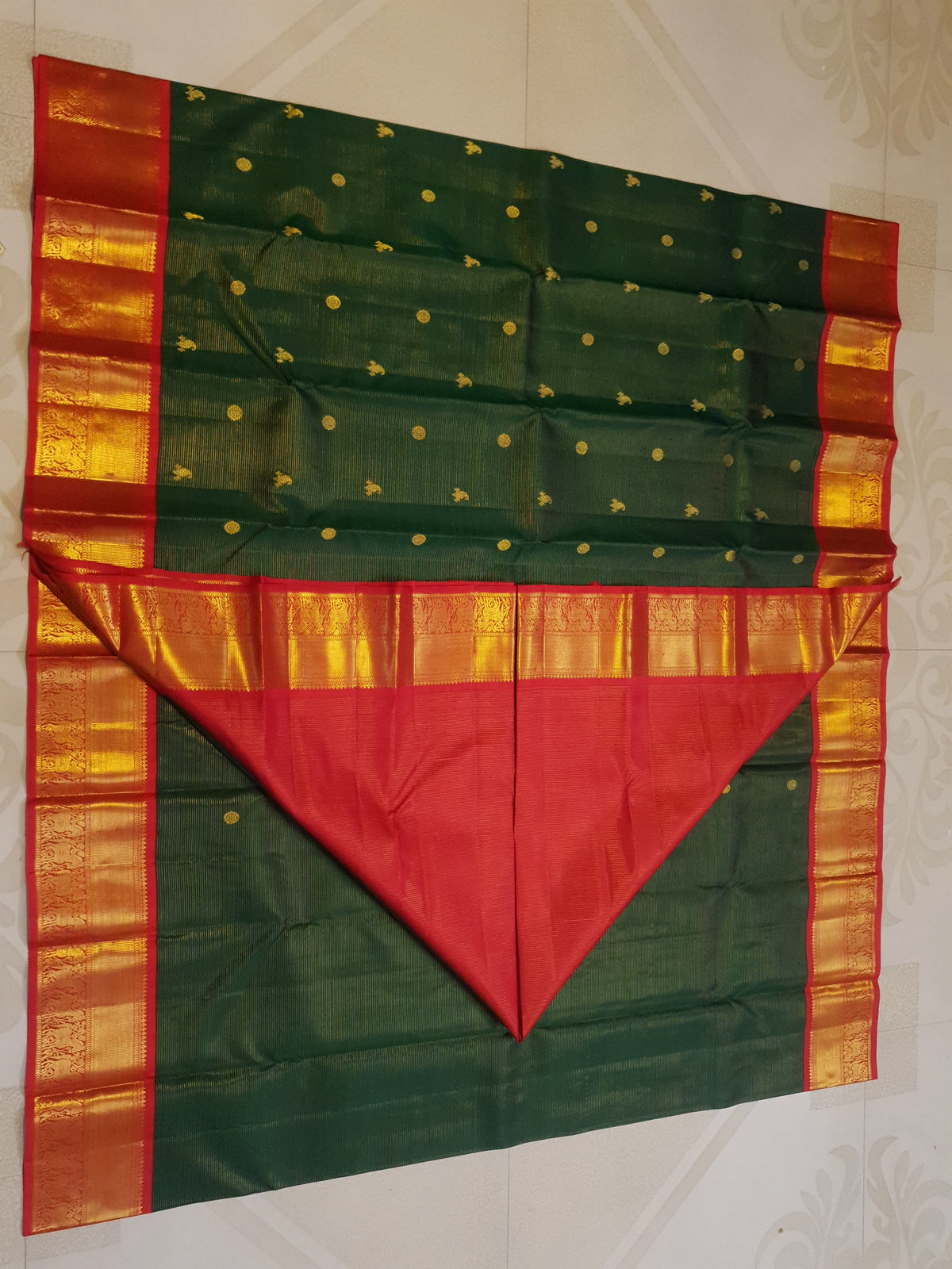 Bottle Green Kanchipuram Handloom 2G Gold Vairaoosi Silk Saree with all-over fine stripes, traditional buttas, and rich contrasting red and gold borders and pallu.