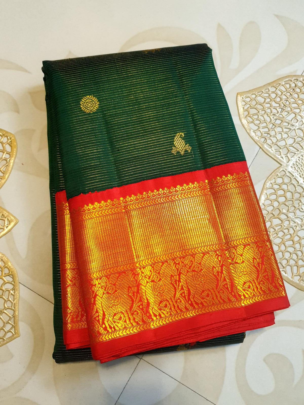 Bottle Green Kanchipuram Handloom 2G Gold Vairaoosi Silk Saree with all-over fine stripes, traditional buttas, and rich contrasting red and gold borders and pallu.