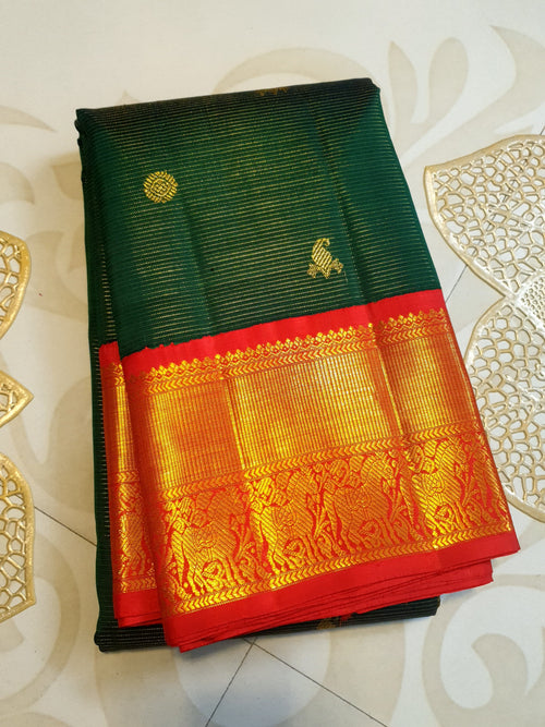 Bottle Green Kanchipuram Handloom 2G Gold Vairaoosi Silk Saree with all-over fine stripes, traditional buttas, and rich contrasting red and gold borders and pallu.