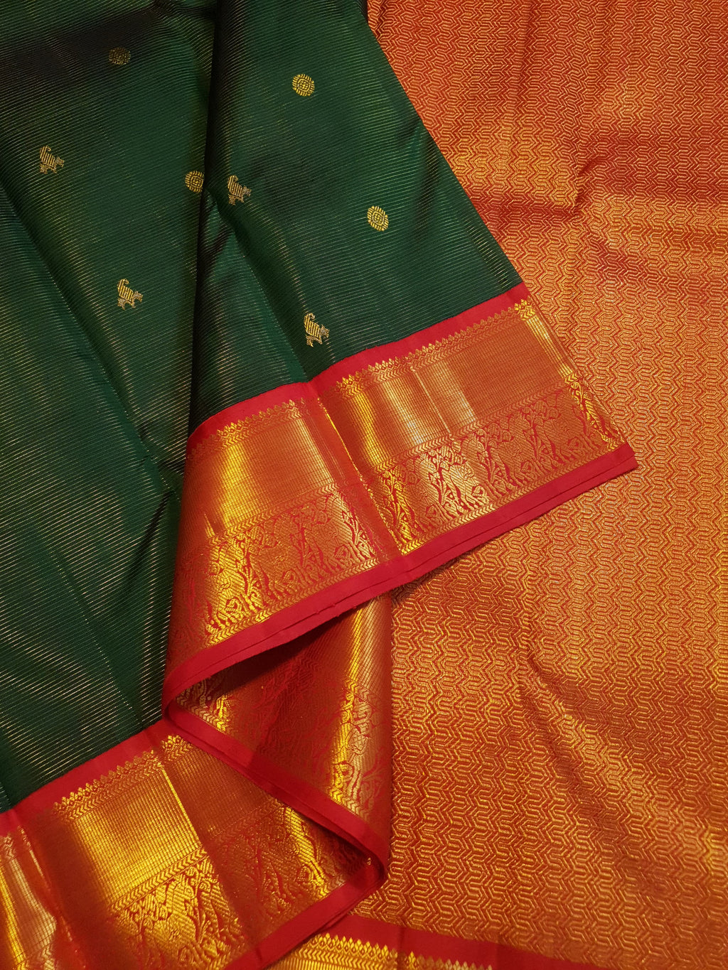 Bottle Green Kanchipuram Handloom 2G Gold Vairaoosi Silk Saree with all-over fine stripes, traditional buttas, and rich contrasting red and gold borders and pallu.