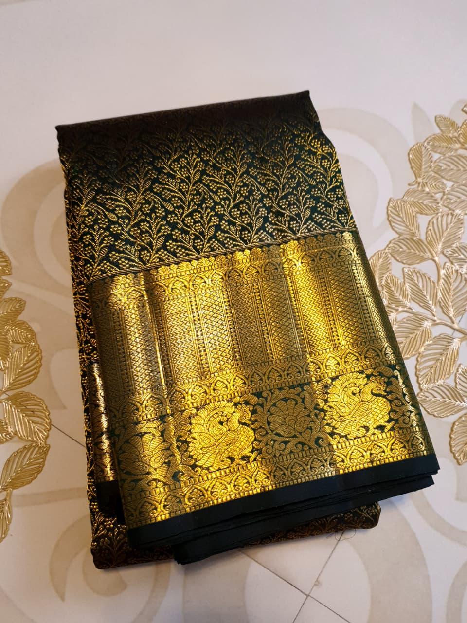 Bottle green Kanchipuram handloom 2G gold bridal silk saree featuring traditional rich zari borders and an all-over intricate brocade weave.