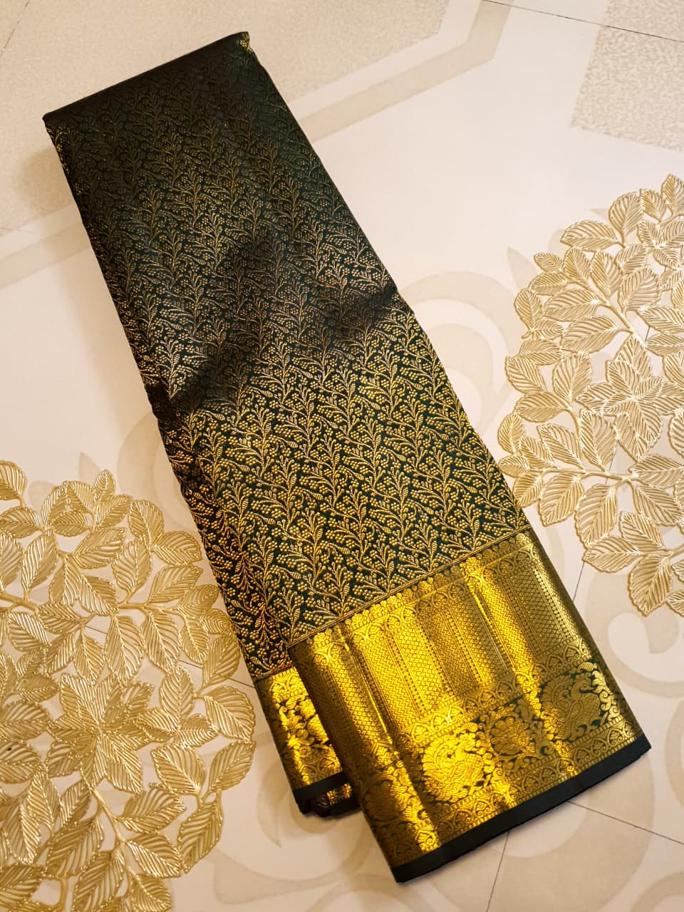 Bottle green Kanchipuram handloom 2G gold bridal silk saree featuring traditional rich zari borders and an all-over intricate brocade weave.