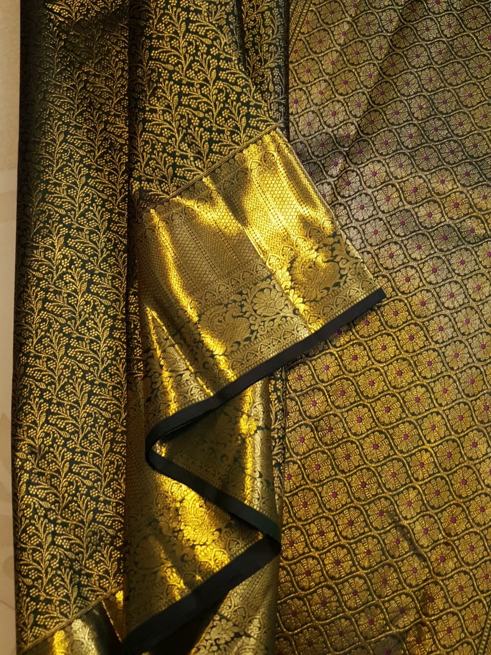 Bottle green Kanchipuram handloom 2G gold bridal silk saree featuring traditional rich zari borders and an all-over intricate brocade weave.