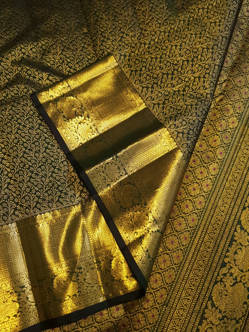 Bottle green Kanchipuram handloom 2G gold bridal silk saree featuring traditional rich zari borders and an all-over intricate brocade weave.