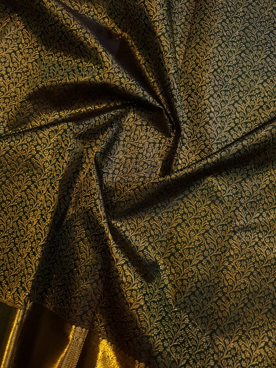Bottle green Kanchipuram handloom 2G gold bridal silk saree featuring traditional rich zari borders and an all-over intricate brocade weave.