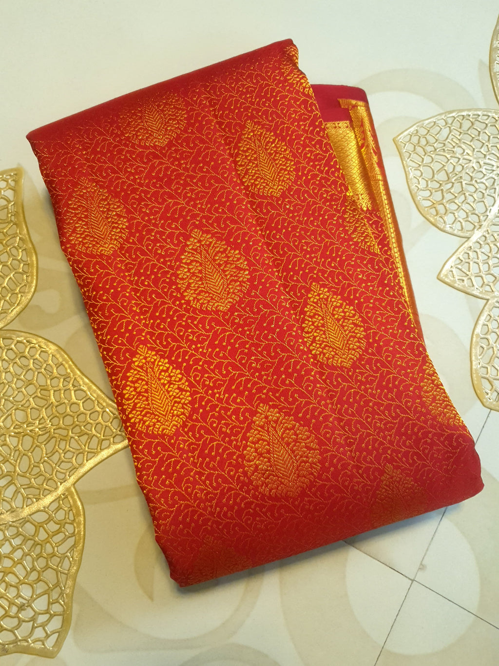 Chilly Red Kanchipuram handloom 2G gold pattu silk saree featuring traditional gold zari weaving and rich elephant and floral motifs.