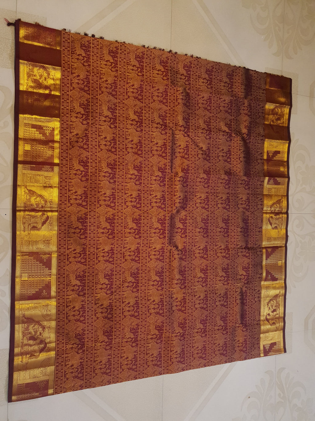 Rustic red Kanchipuram handloom 2G gold palaki design silk saree with rich gold zari weaving and traditional borders.