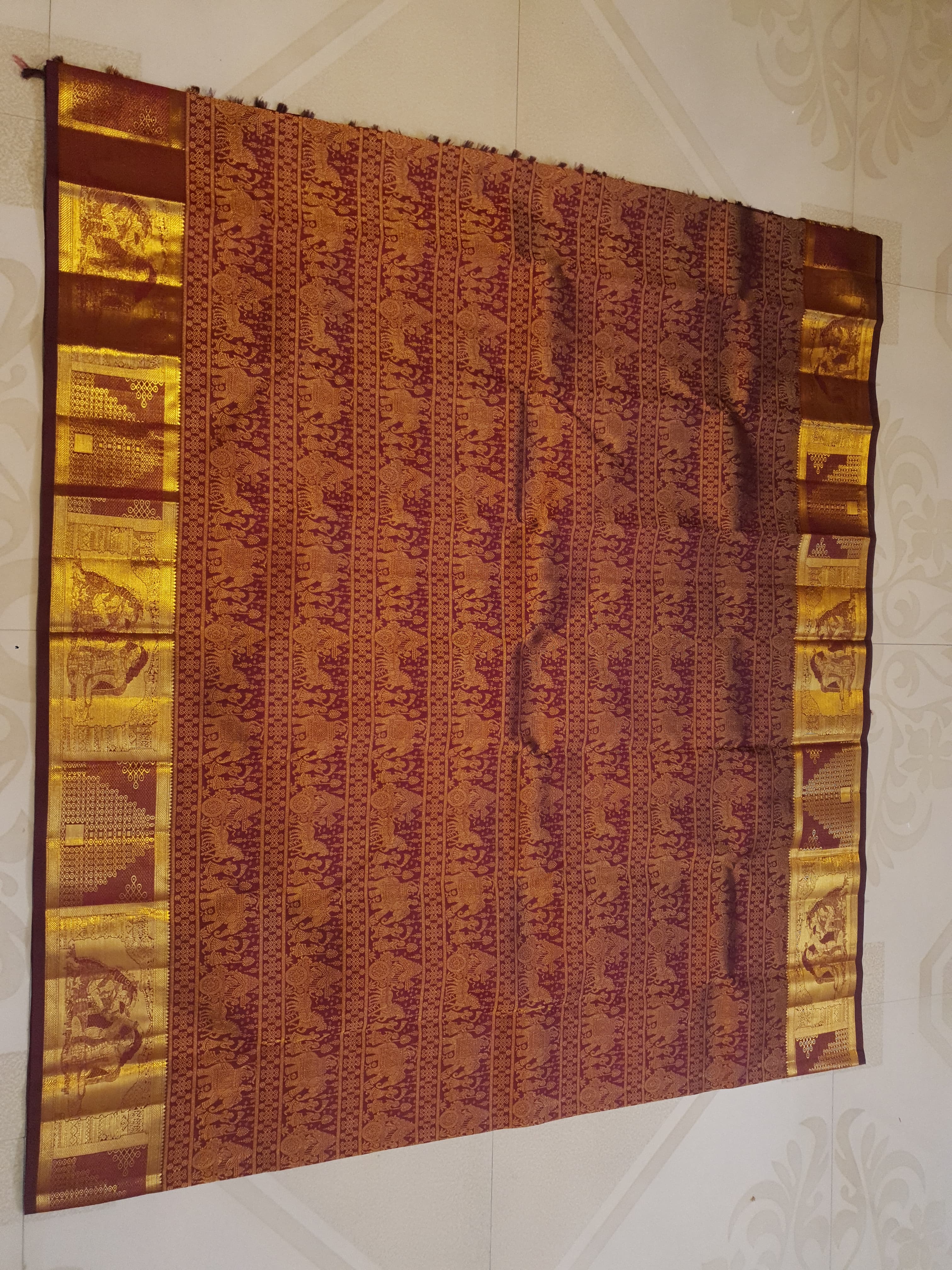 Rustic red Kanchipuram handloom 2G gold palaki design silk saree with rich gold zari weaving and traditional borders.