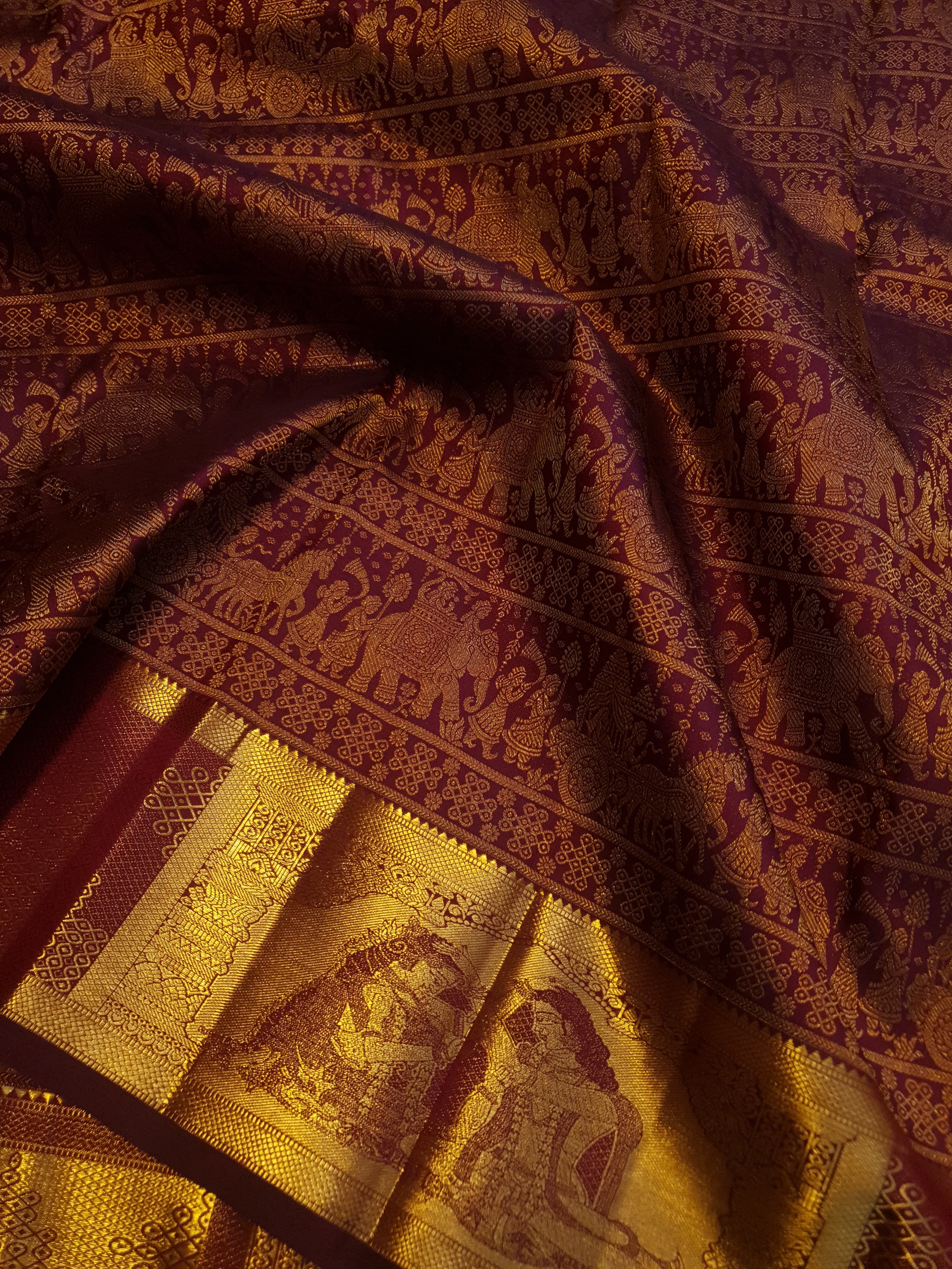 Rustic red Kanchipuram handloom 2G gold palaki design silk saree with rich gold zari weaving and traditional borders.