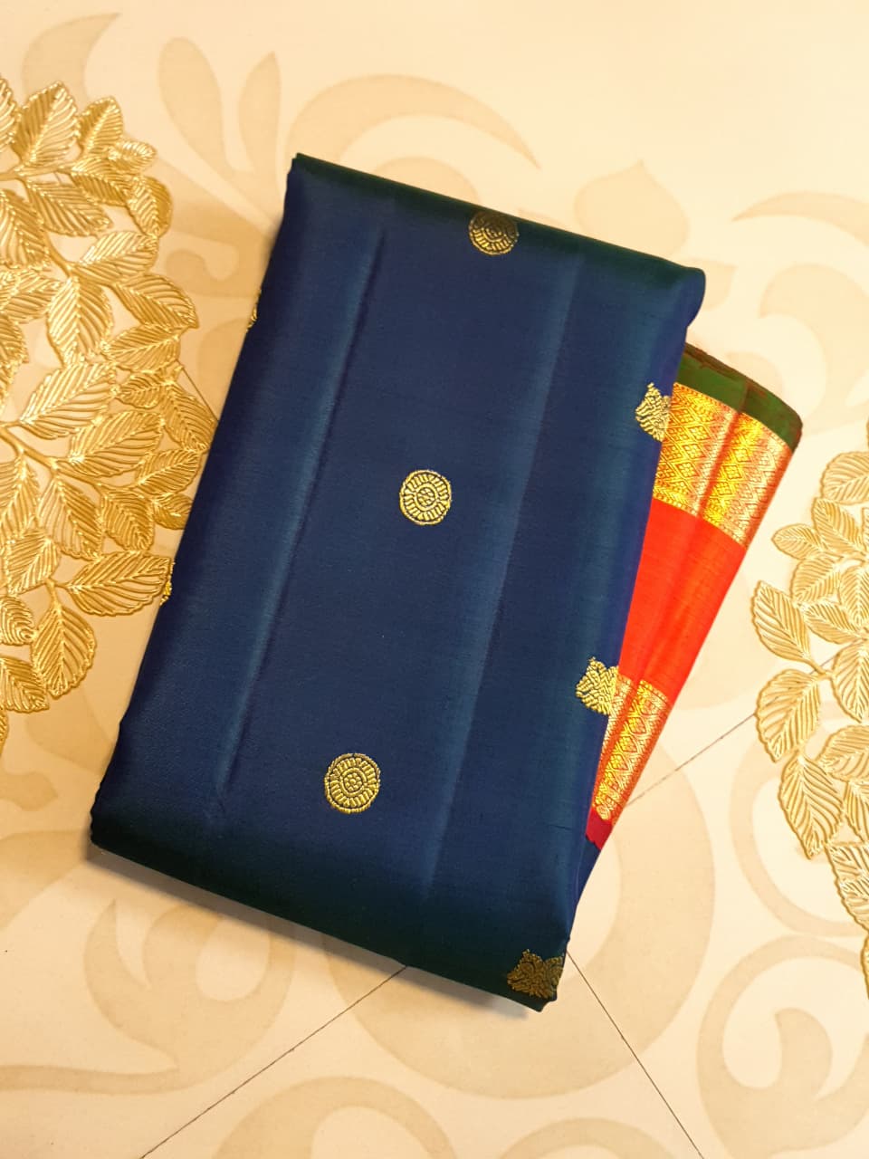Midnight Blue Kanchipuram Handloom 2G Gold Korvai Silk Saree with contrasting orange gap borders and traditional motifs.