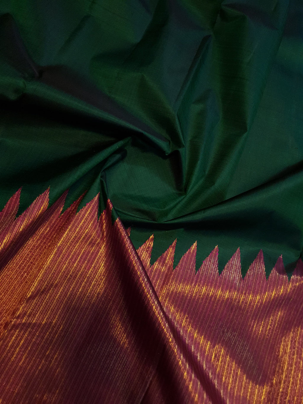 Bottle Green Kanchipuram handloom 2G gold temple silk saree featuring traditional gold zari weaving and classic temple borders.