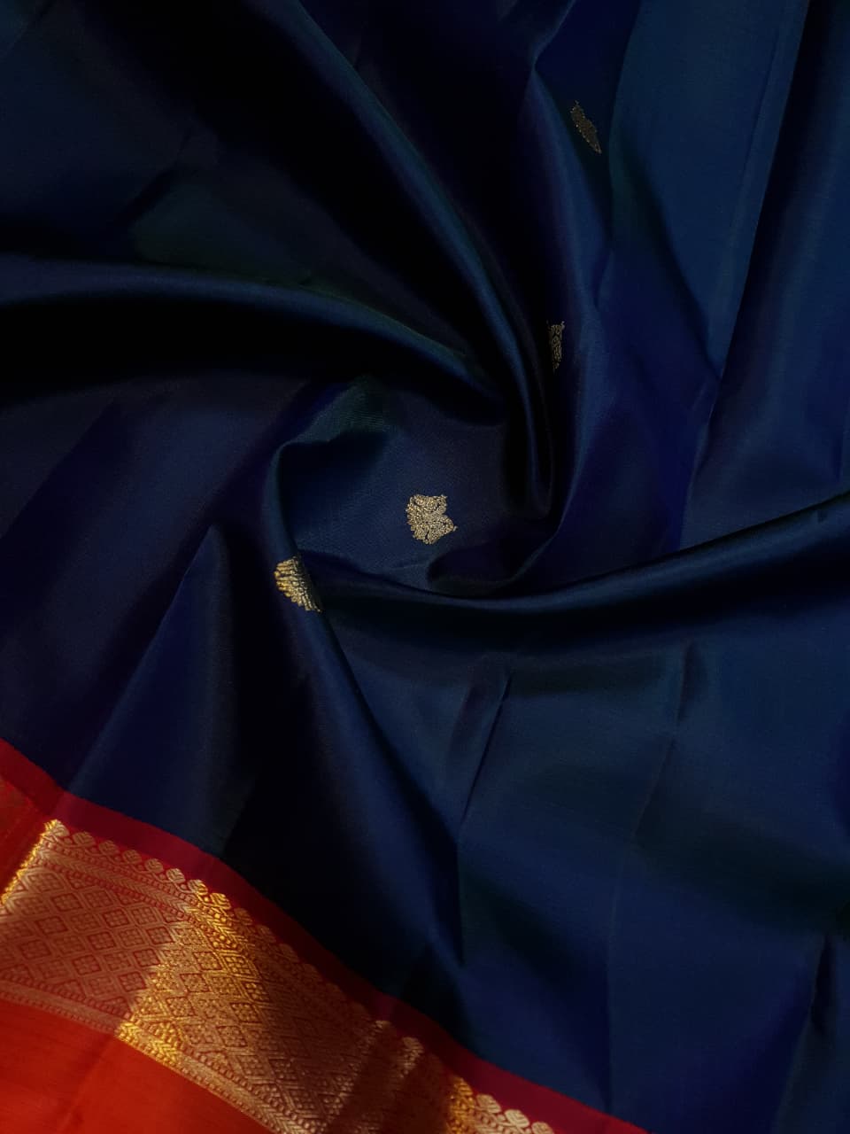 Midnight Blue Kanchipuram Handloom 2G Gold Korvai Silk Saree with contrasting orange gap borders and traditional motifs.