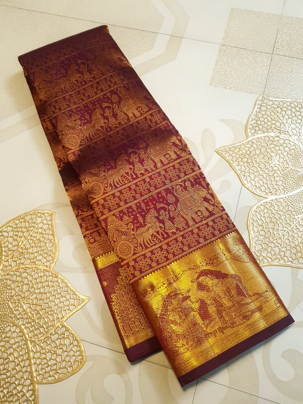 Rustic red Kanchipuram handloom 2G gold palaki design silk saree with rich gold zari weaving and traditional borders.