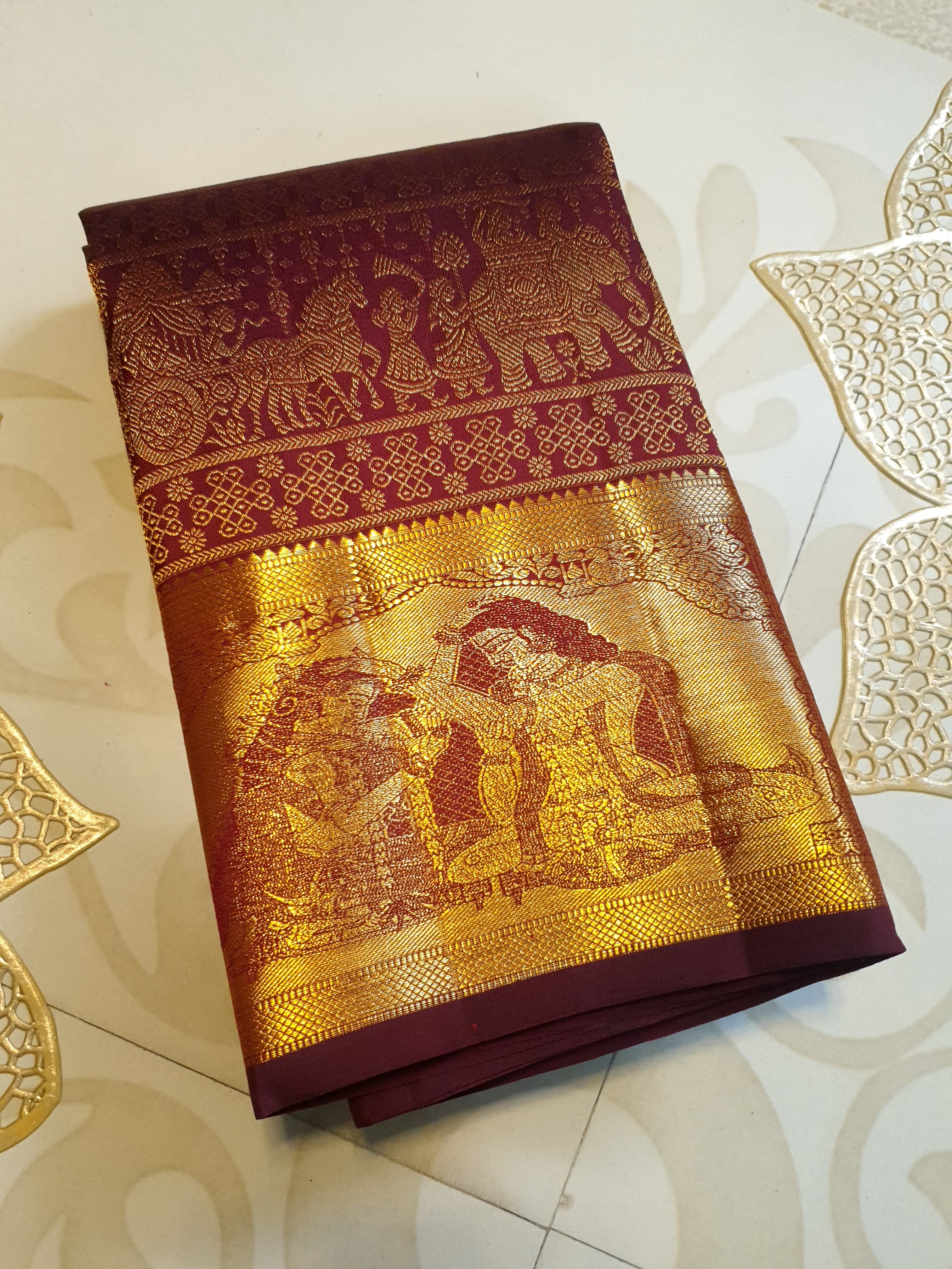 Rustic red Kanchipuram handloom 2G gold palaki design silk saree with rich gold zari weaving and traditional borders.