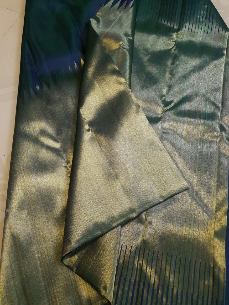 Midnight Blue Kanchipuram handloom 2G gold temple silk saree featuring traditional gold zari weaving and classic temple borders.