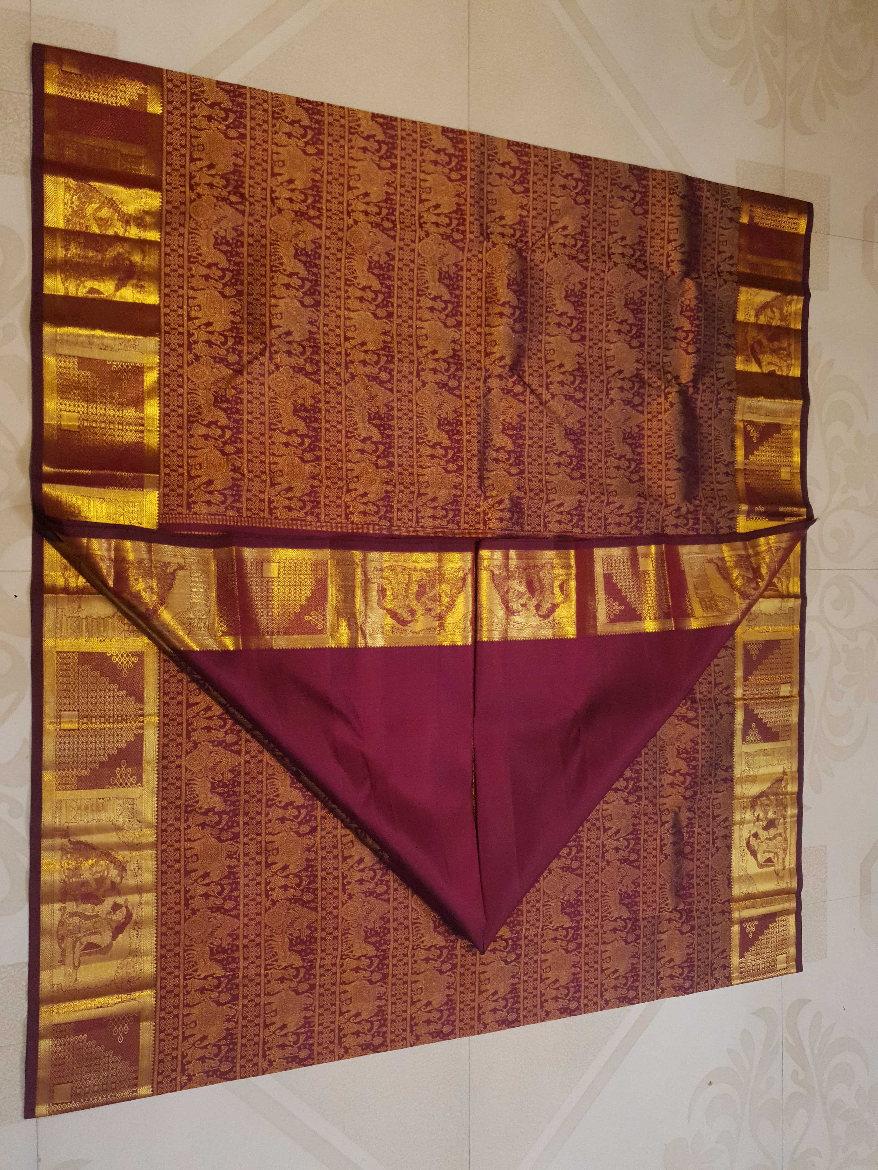 Rustic red Kanchipuram handloom 2G gold palaki design silk saree with rich gold zari weaving and traditional borders.