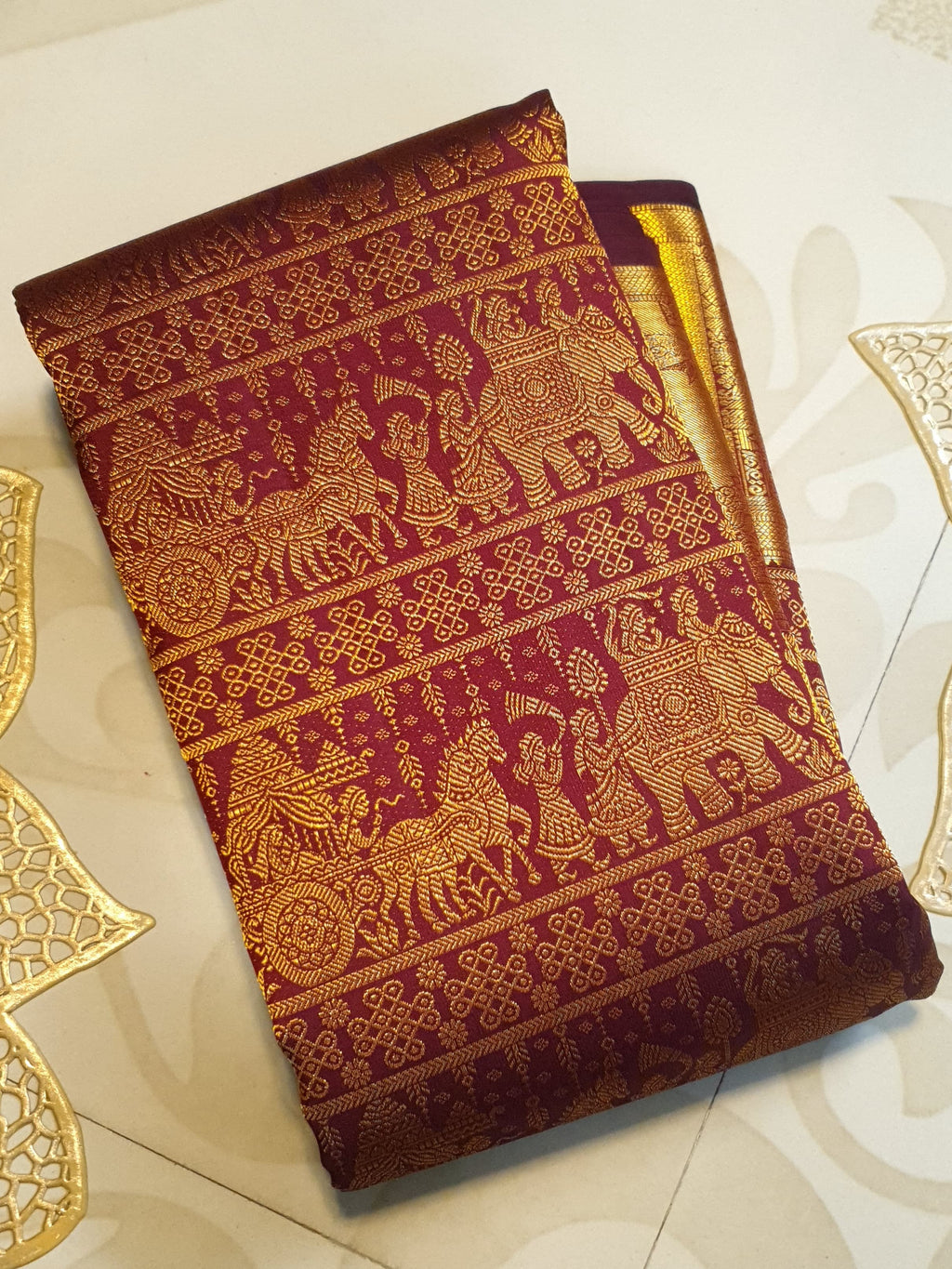 Rustic red Kanchipuram handloom 2G gold palaki design silk saree with rich gold zari weaving and traditional borders.