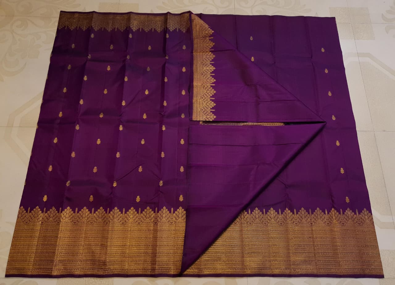 Magenta Kanchipuram handloom 2G gold pattu silk saree featuring traditional gold zari weaving and rich motifs.
