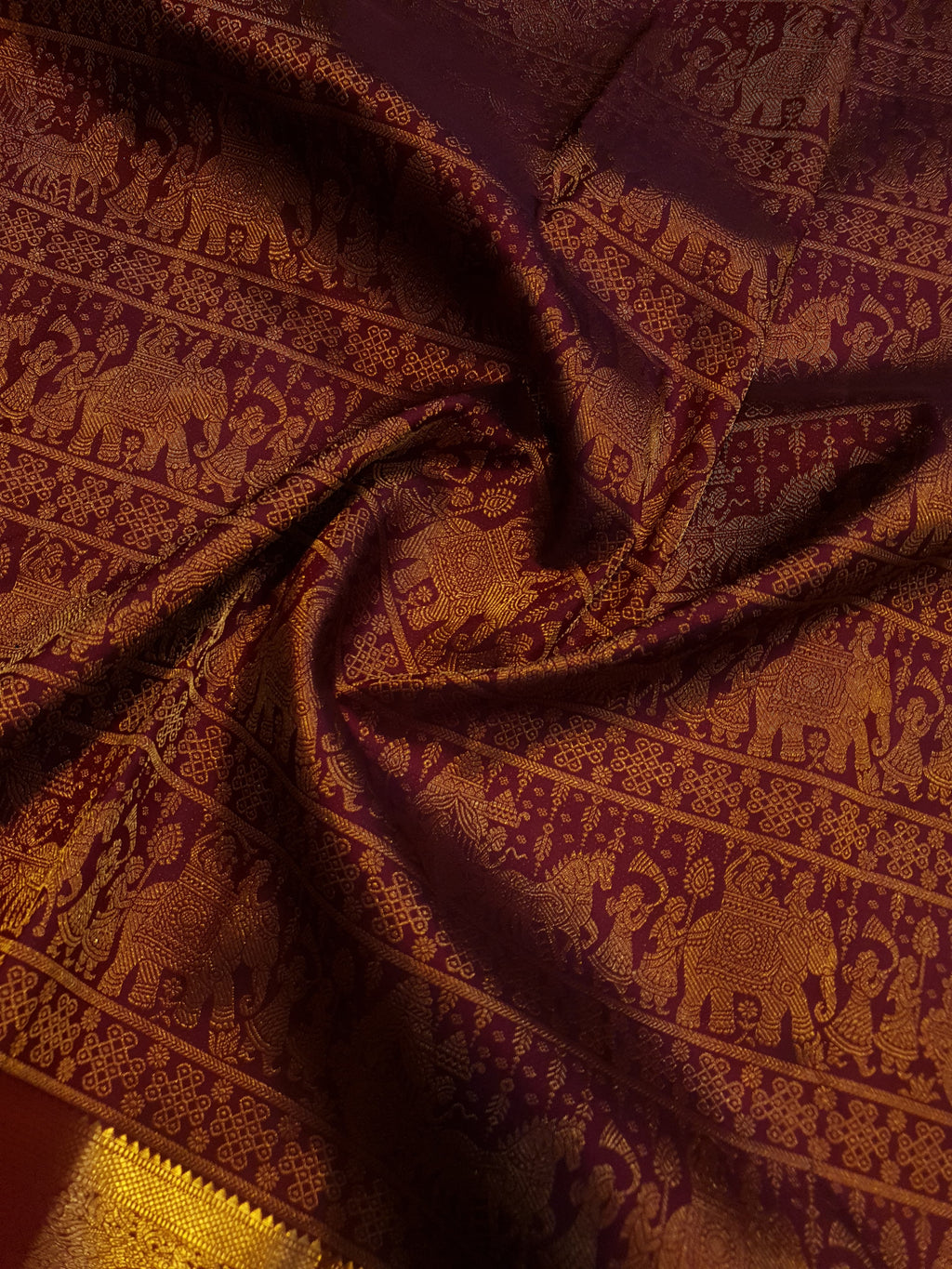 Rustic red Kanchipuram handloom 2G gold palaki design silk saree with rich gold zari weaving and traditional borders.