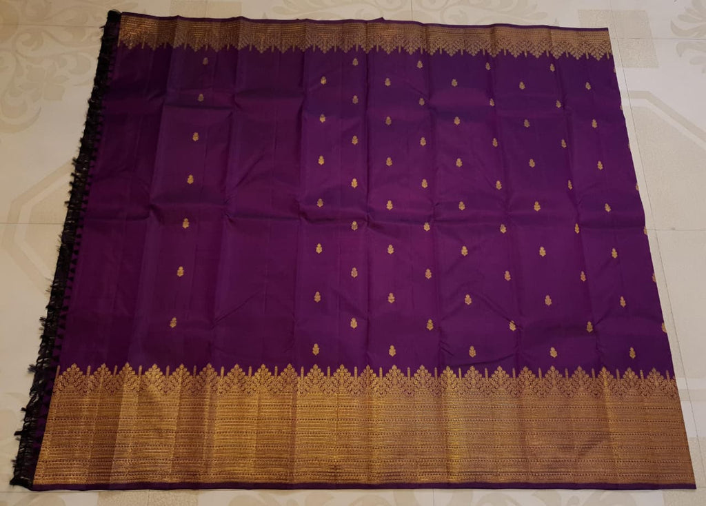 Magenta Kanchipuram handloom 2G gold pattu silk saree featuring traditional gold zari weaving and rich motifs.