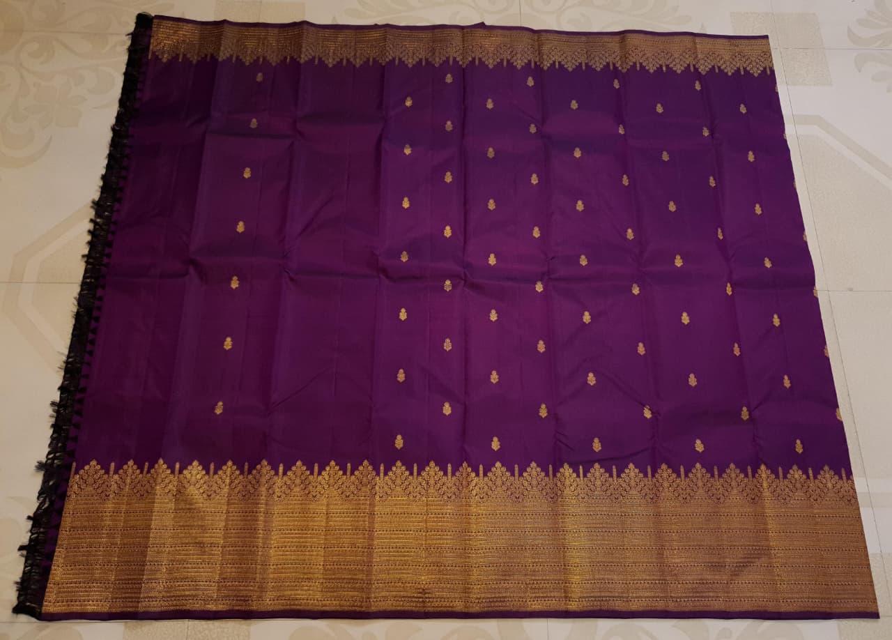 Magenta Kanchipuram handloom 2G gold pattu silk saree featuring traditional gold zari weaving and rich motifs.