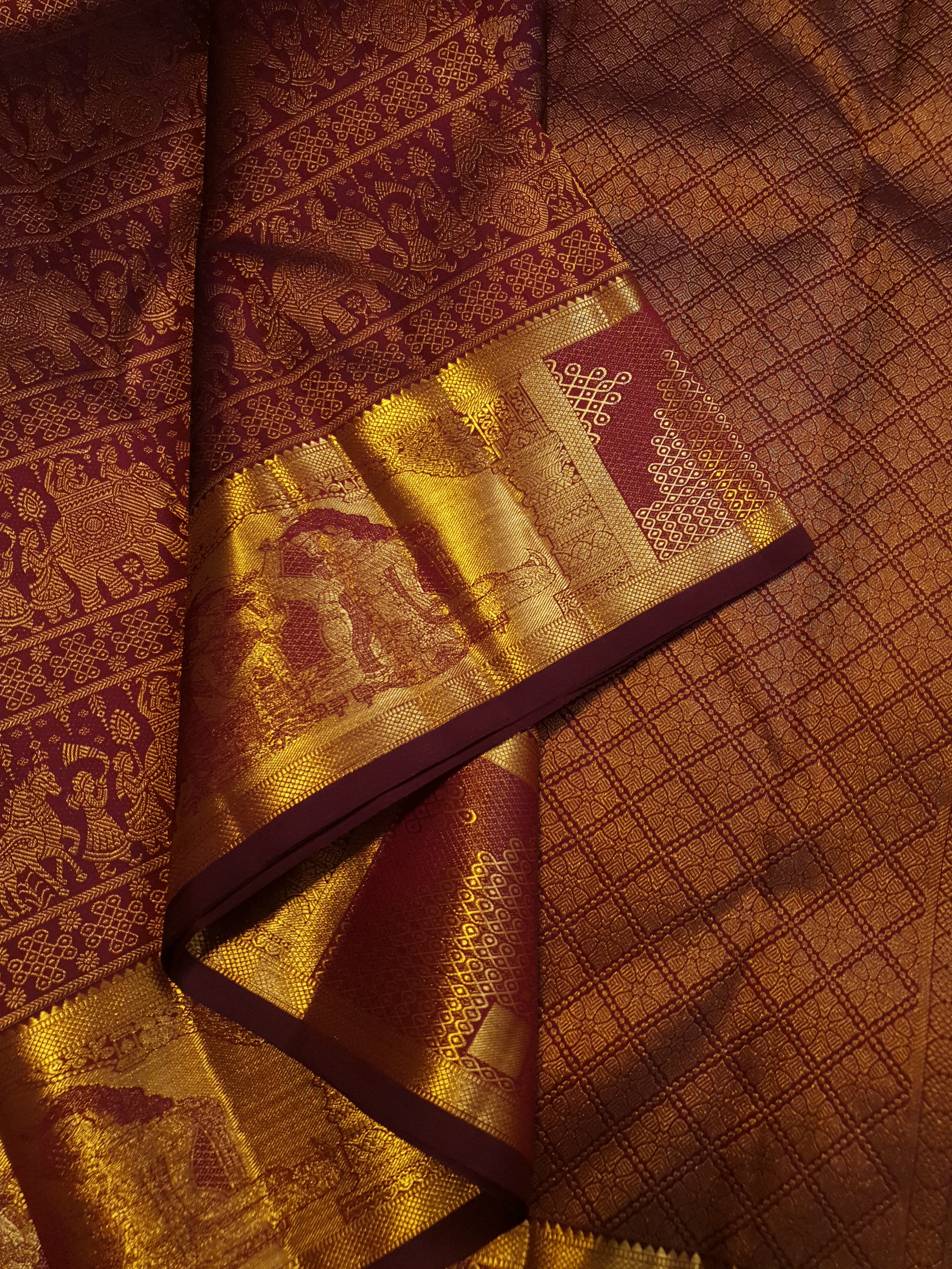Rustic red Kanchipuram handloom 2G gold palaki design silk saree with rich gold zari weaving and traditional borders.