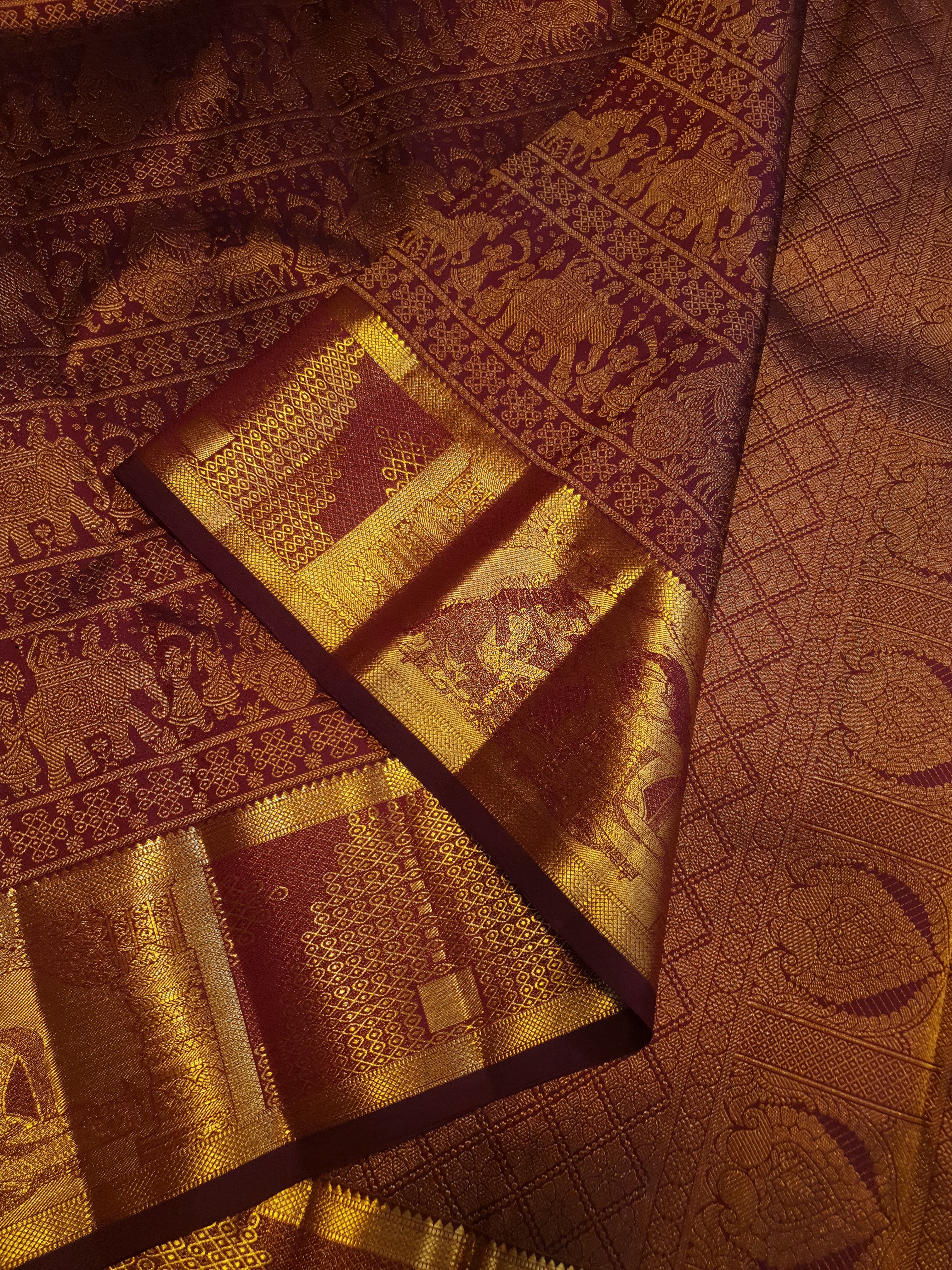 Rustic red Kanchipuram handloom 2G gold palaki design silk saree with rich gold zari weaving and traditional borders.
