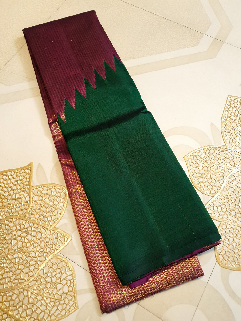 Bottle Green Kanchipuram handloom 2G gold temple silk saree featuring traditional gold zari weaving and classic temple borders.