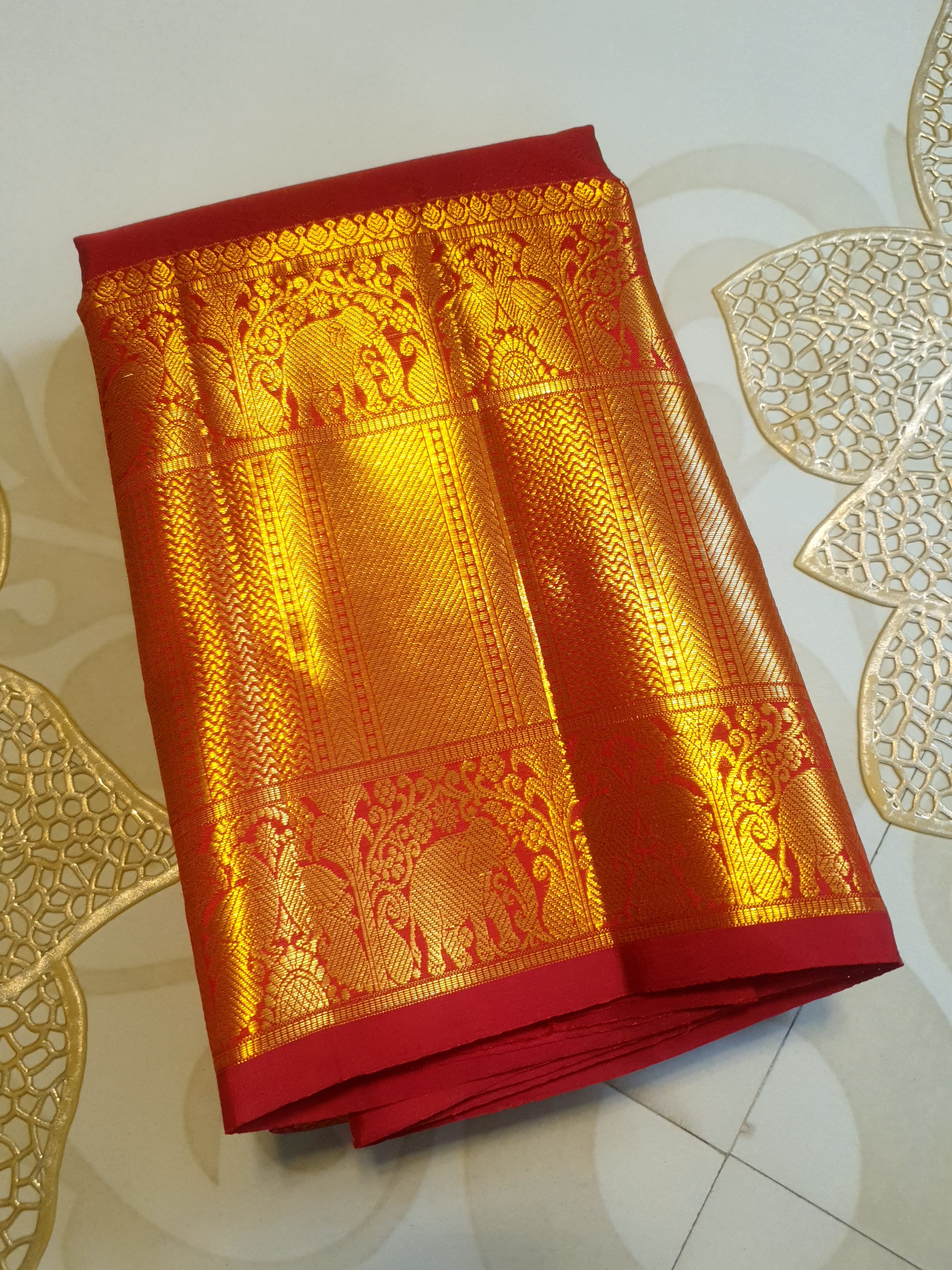 Chilly Red Kanchipuram handloom 2G gold pattu silk saree featuring traditional gold zari weaving and rich elephant and floral motifs.