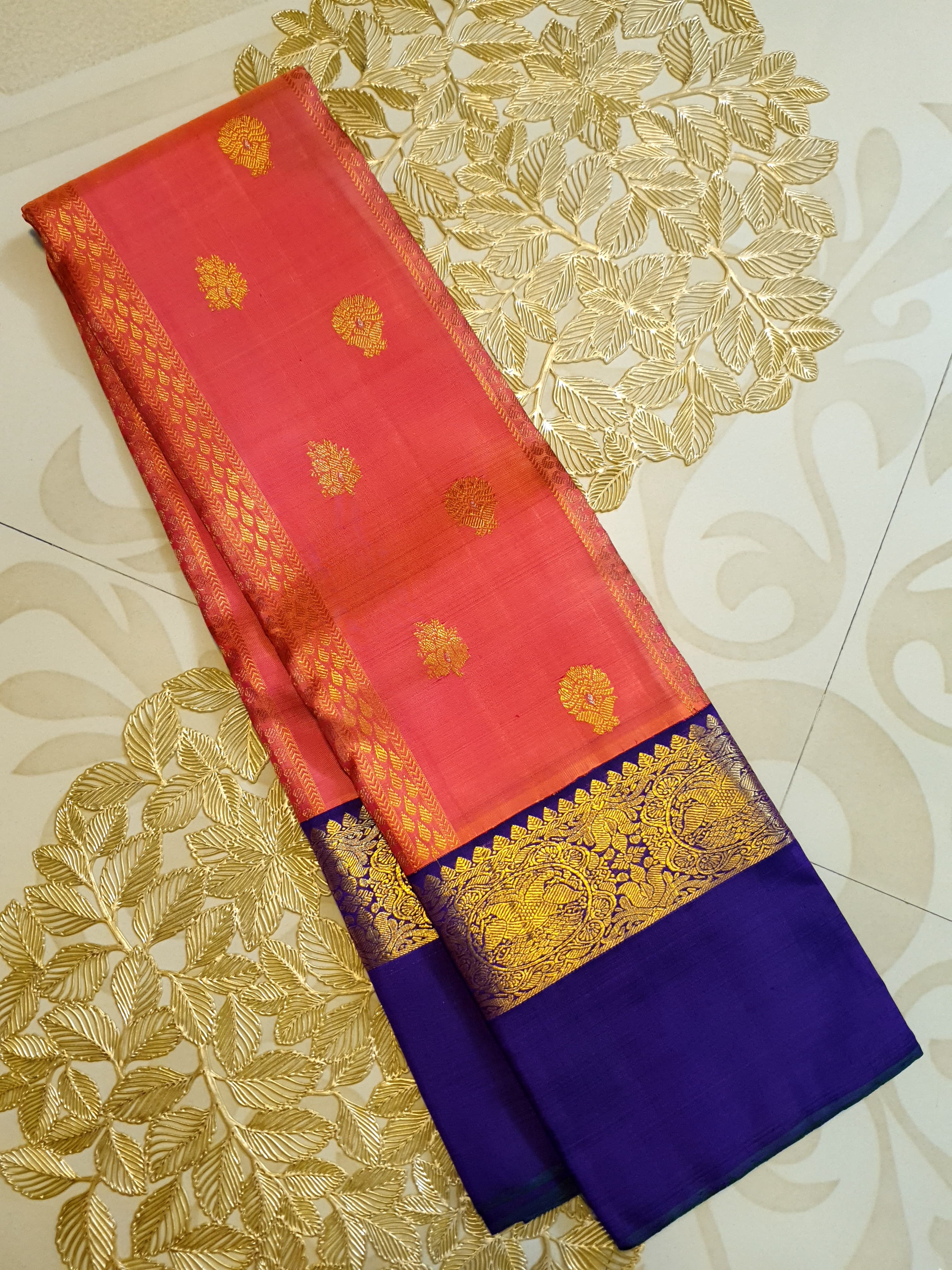 Kanchipuram Handloom 2G Gold Korvai Silk Saree with rich purple and gold zari borders and traditional motifs.