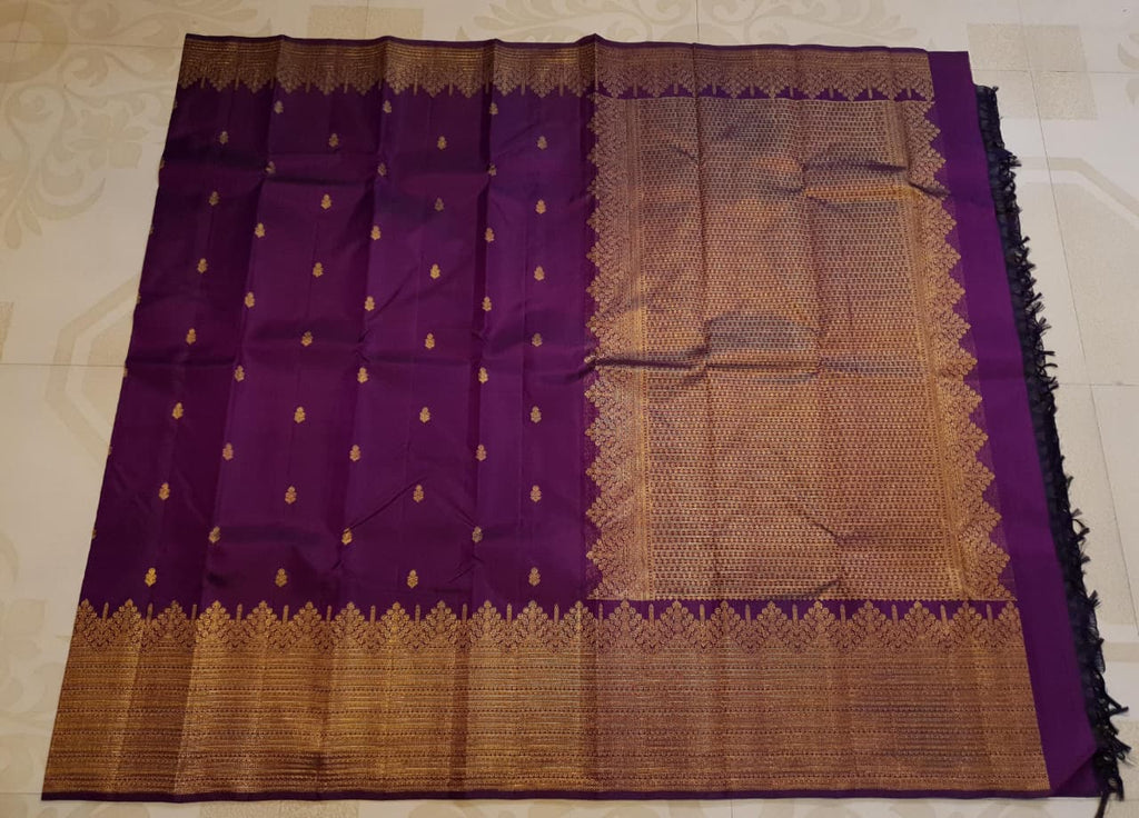 Magenta Kanchipuram handloom 2G gold pattu silk saree featuring traditional gold zari weaving and rich motifs.
