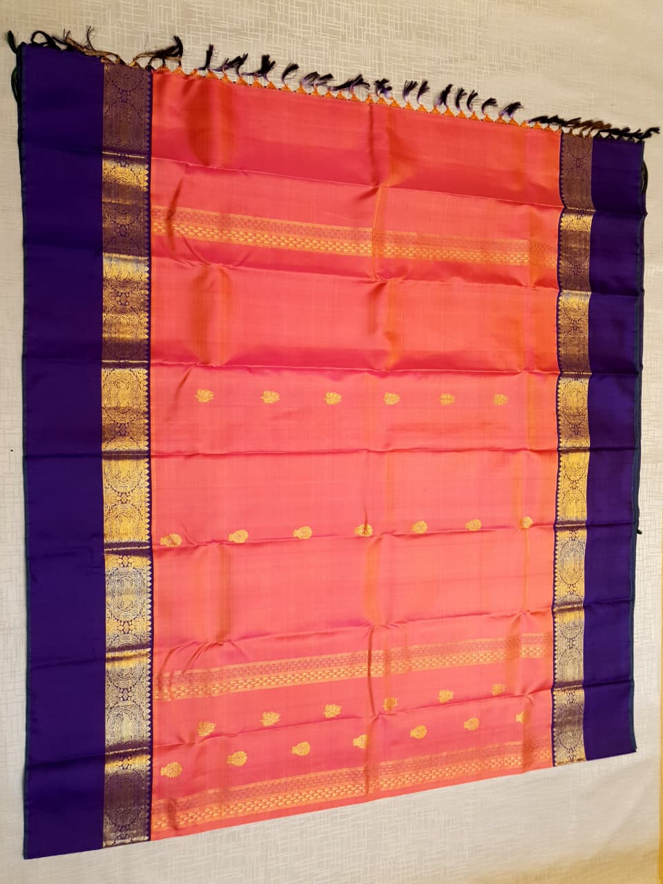 Kanchipuram Handloom 2G Gold Korvai Silk Saree with rich purple and gold zari borders and traditional motifs.