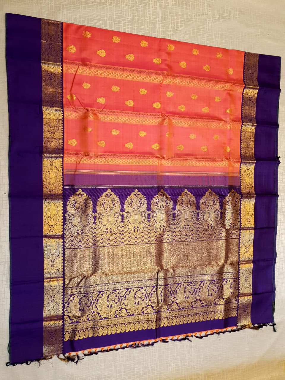 Kanchipuram Handloom 2G Gold Korvai Silk Saree with rich purple and gold zari borders and traditional motifs.