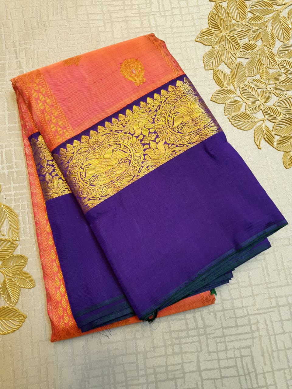 Kanchipuram Handloom 2G Gold Korvai Silk Saree with rich purple and gold zari borders and traditional motifs.