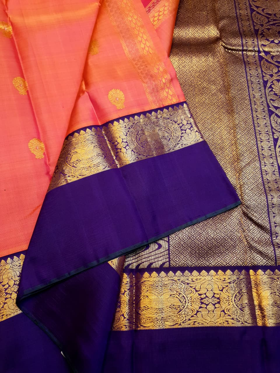 Kanchipuram Handloom 2G Gold Korvai Silk Saree with rich purple and gold zari borders and traditional motifs.