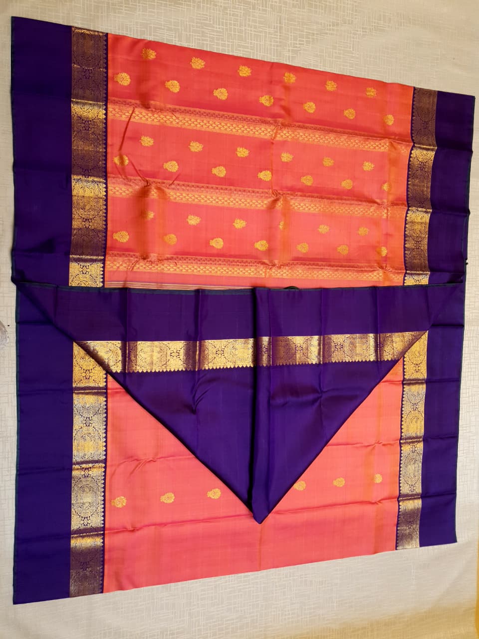 Kanchipuram Handloom 2G Gold Korvai Silk Saree with rich purple and gold zari borders and traditional motifs.