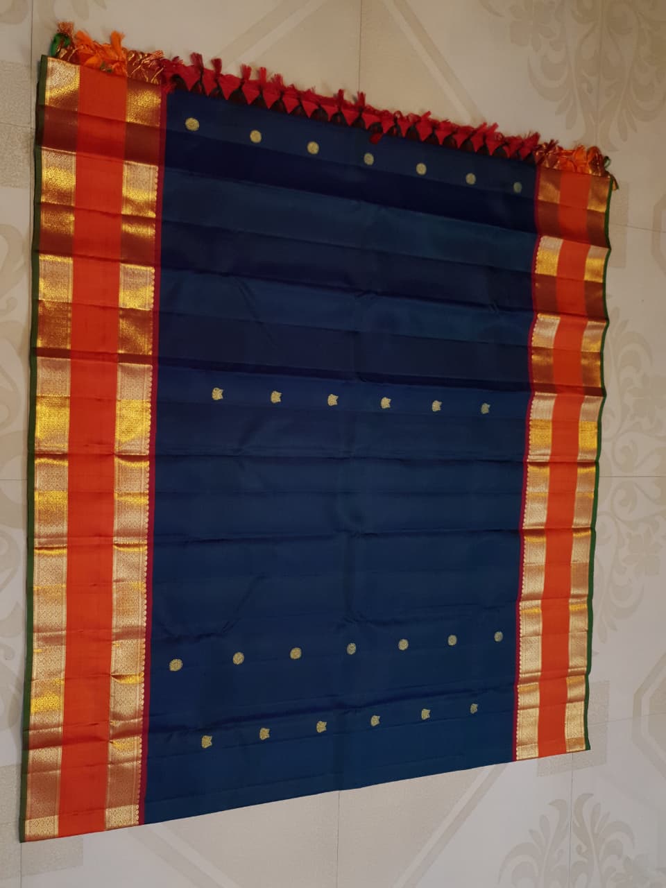Midnight Blue Kanchipuram Handloom 2G Gold Korvai Silk Saree with contrasting orange gap borders and traditional motifs.