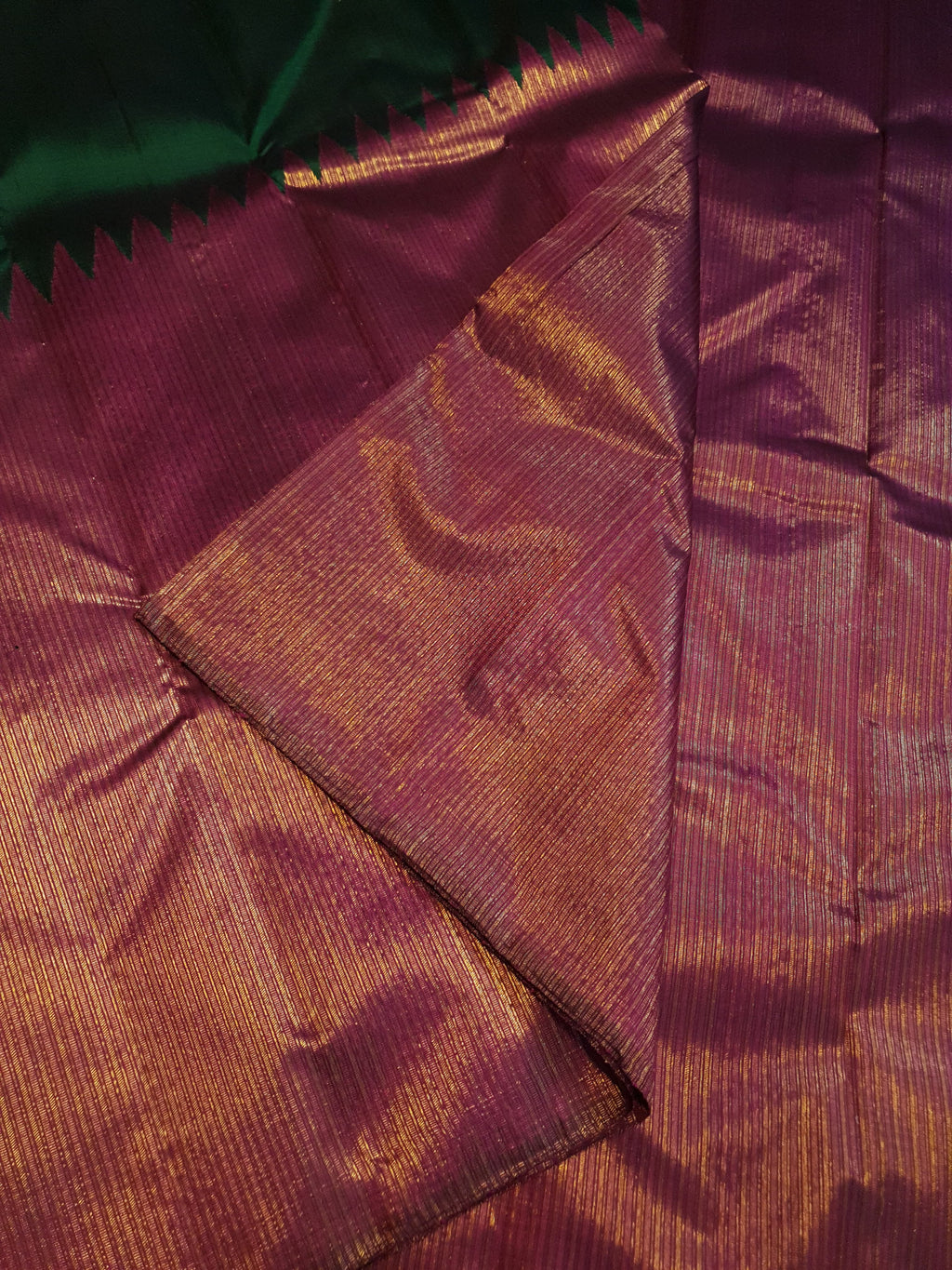 Bottle Green Kanchipuram handloom 2G gold temple silk saree featuring traditional gold zari weaving and classic temple borders.