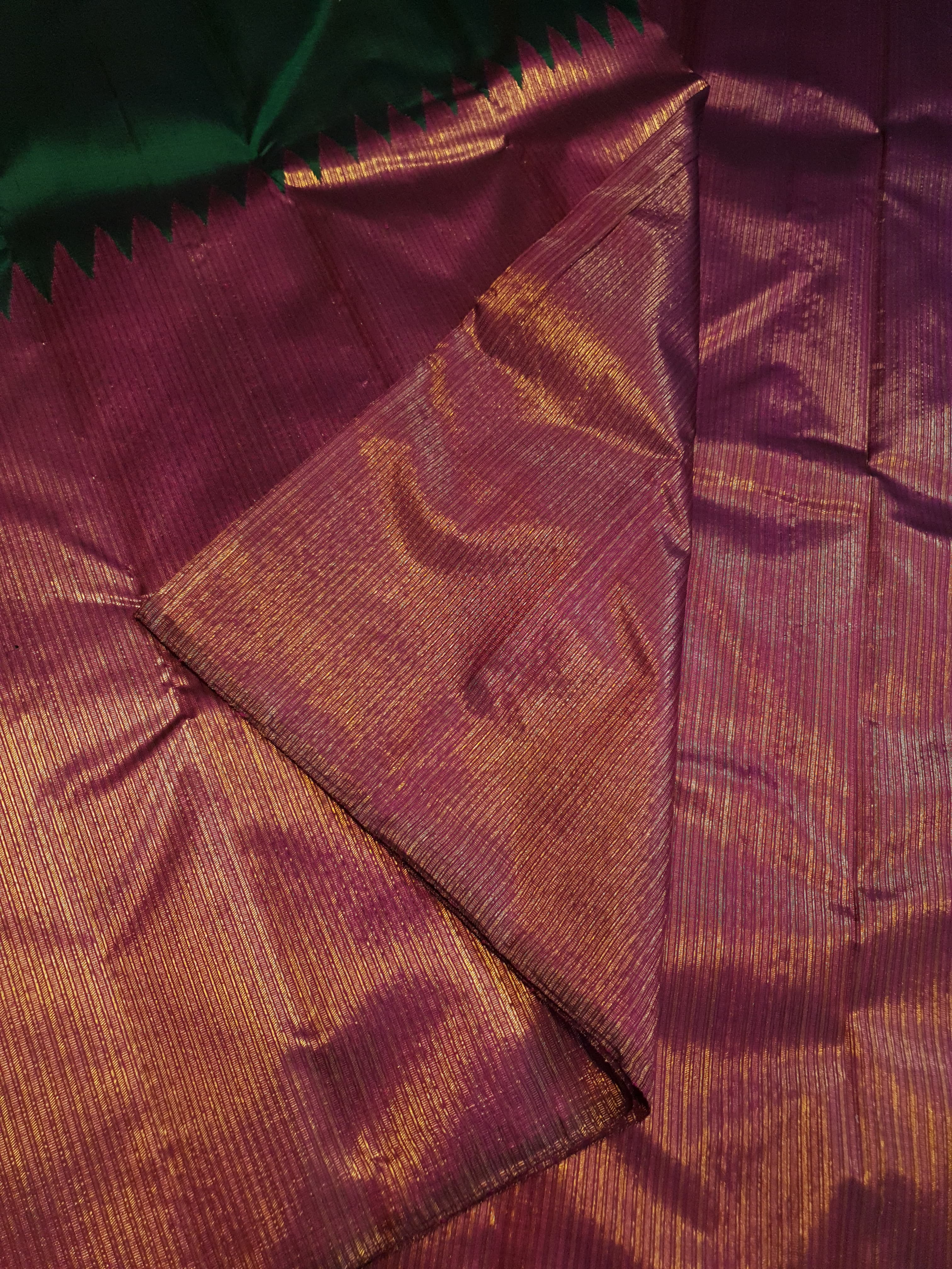 Bottle Green Kanchipuram handloom 2G gold temple silk saree featuring traditional gold zari weaving and classic temple borders.