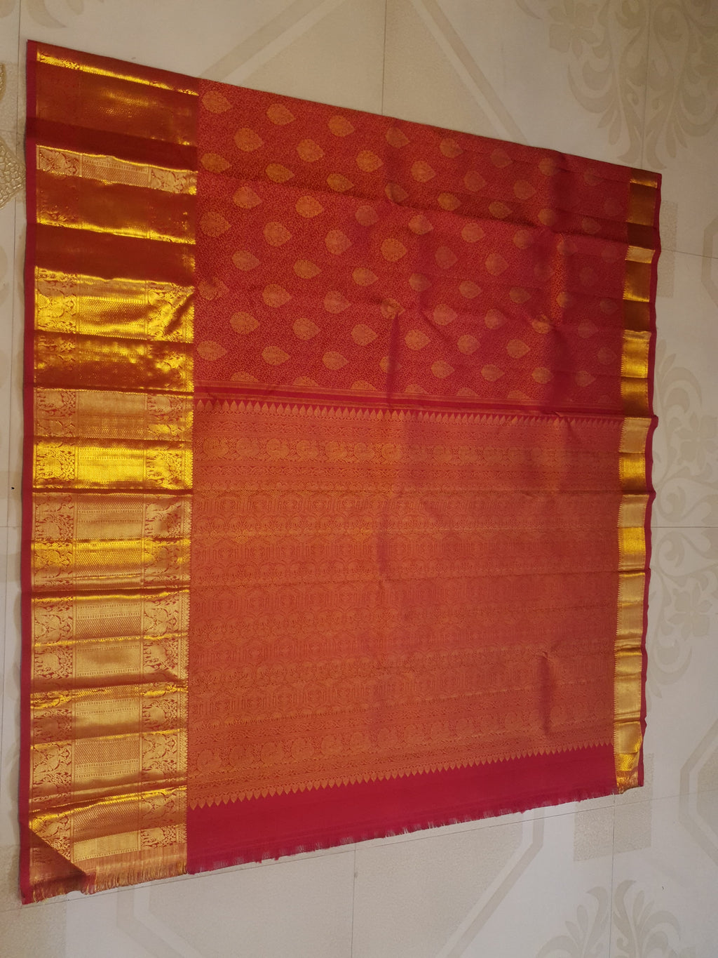 Chilly Red Kanchipuram handloom 2G gold pattu silk saree featuring traditional gold zari weaving and rich elephant and floral motifs.