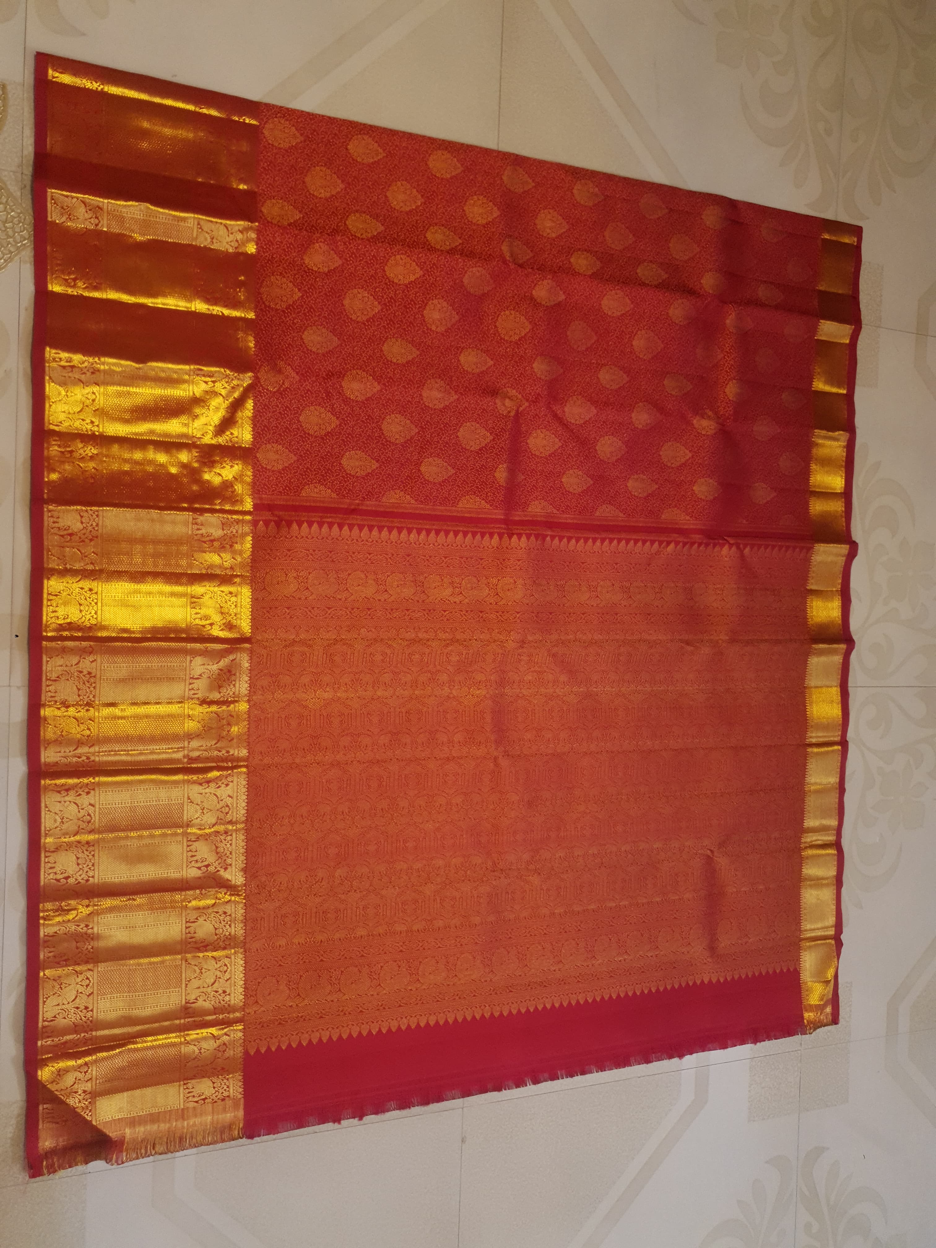 Chilly Red Kanchipuram handloom 2G gold pattu silk saree featuring traditional gold zari weaving and rich elephant and floral motifs.
