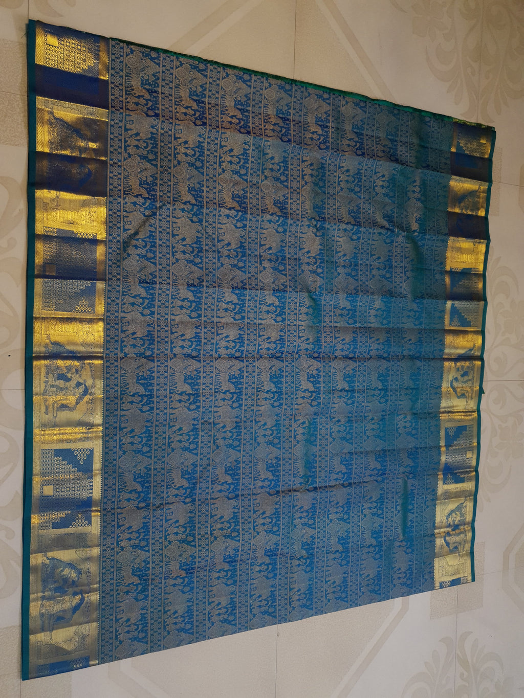 Dual Tone Peacock Blue Kanchipuram Handloom 2G Gold pattu silk saree featuring intricate palaki (Kalyana Pallakku) traditional gold zari weaving.