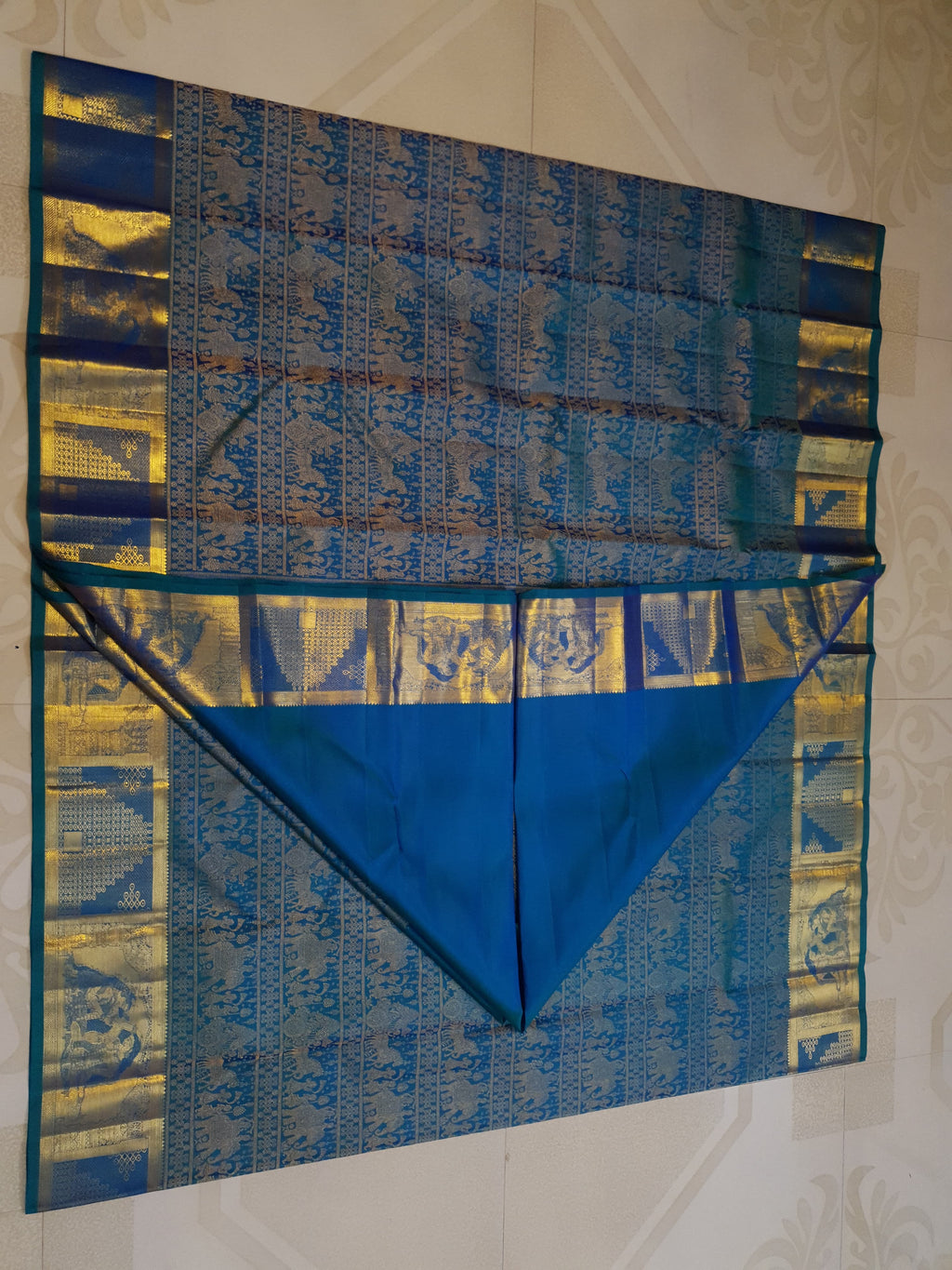 Dual Tone Peacock Blue Kanchipuram Handloom 2G Gold pattu silk saree featuring intricate palaki (Kalyana Pallakku) traditional gold zari weaving.