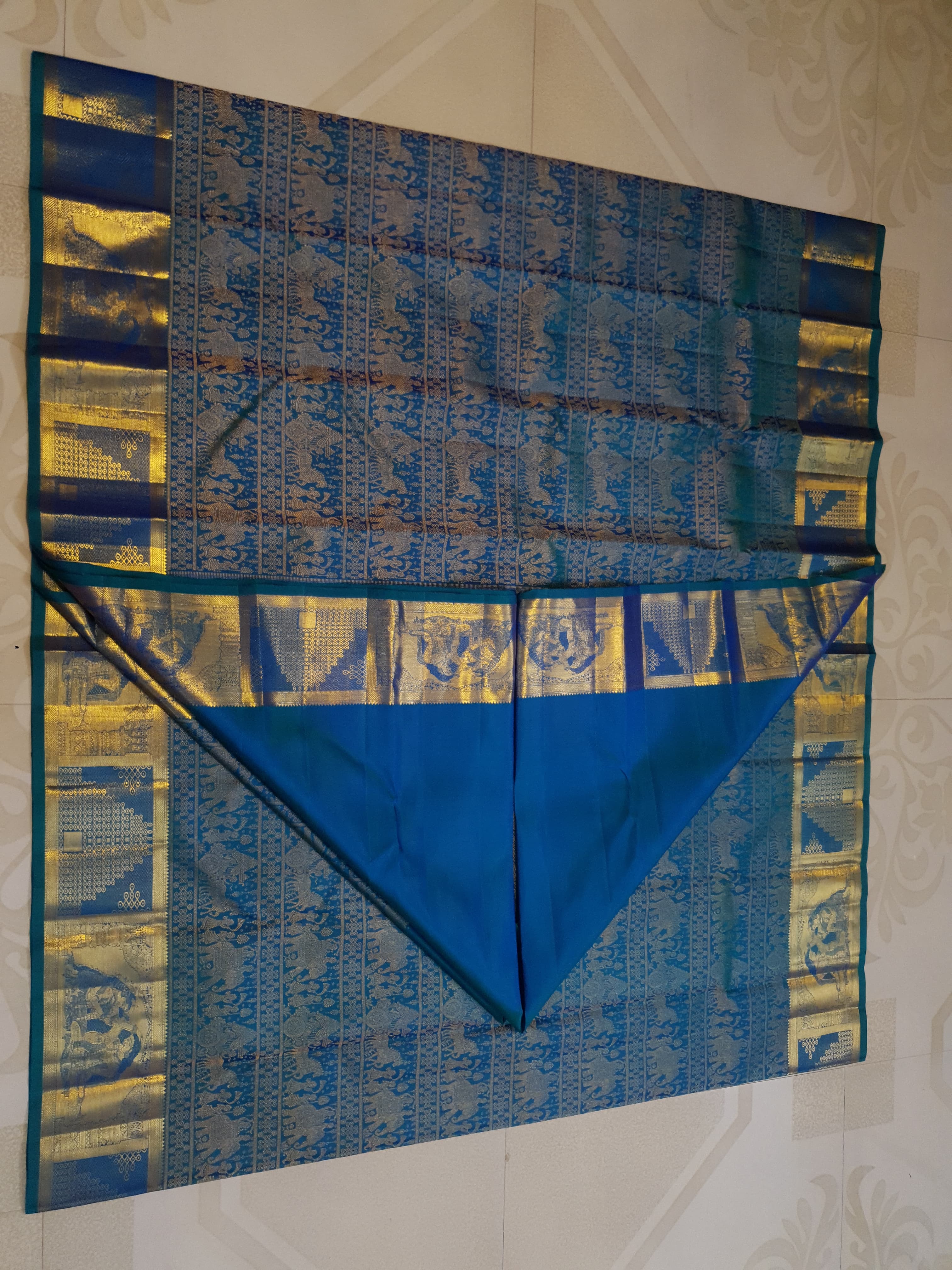 Dual Tone Peacock Blue Kanchipuram Handloom 2G Gold pattu silk saree featuring intricate palaki (Kalyana Pallakku) traditional gold zari weaving.