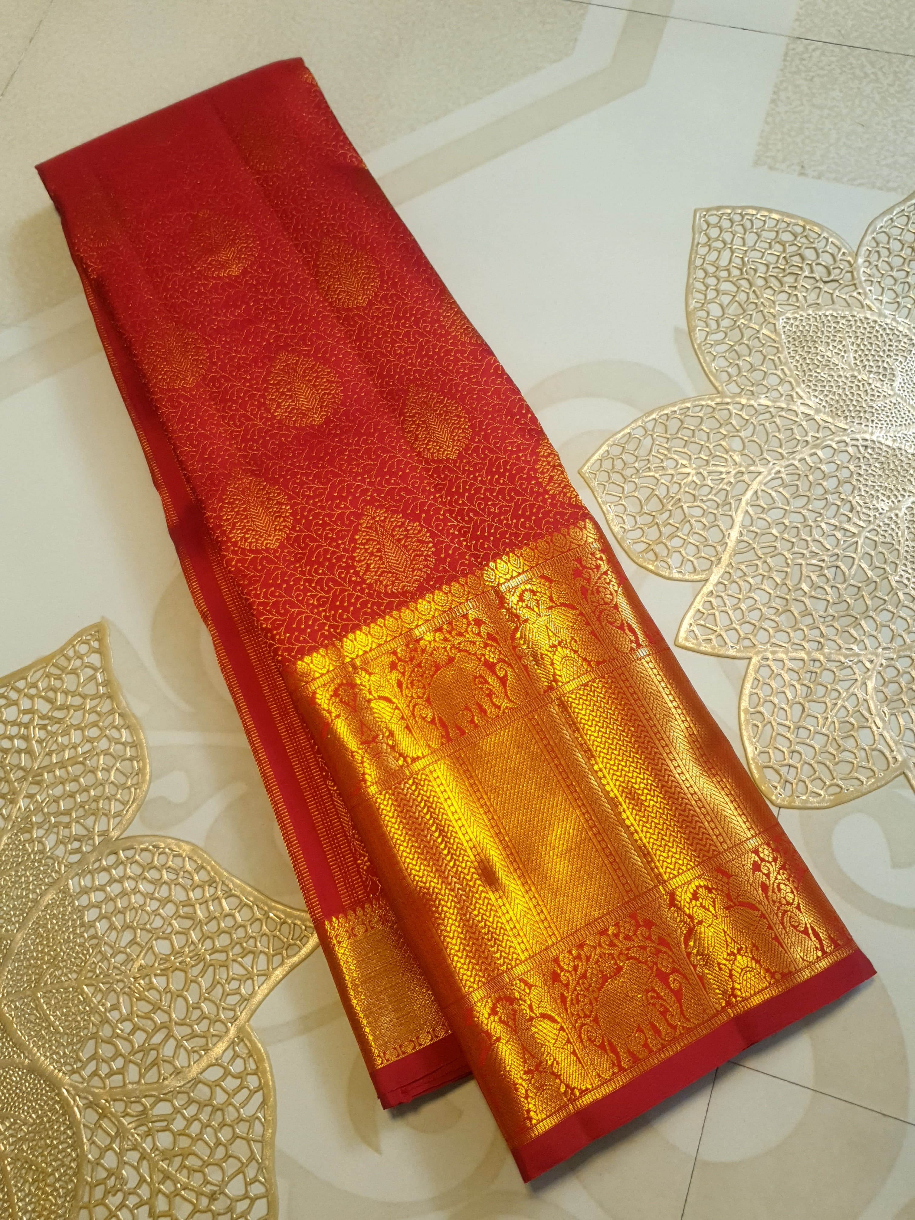 Chilly Red Kanchipuram handloom 2G gold pattu silk saree featuring traditional gold zari weaving and rich elephant and floral motifs.