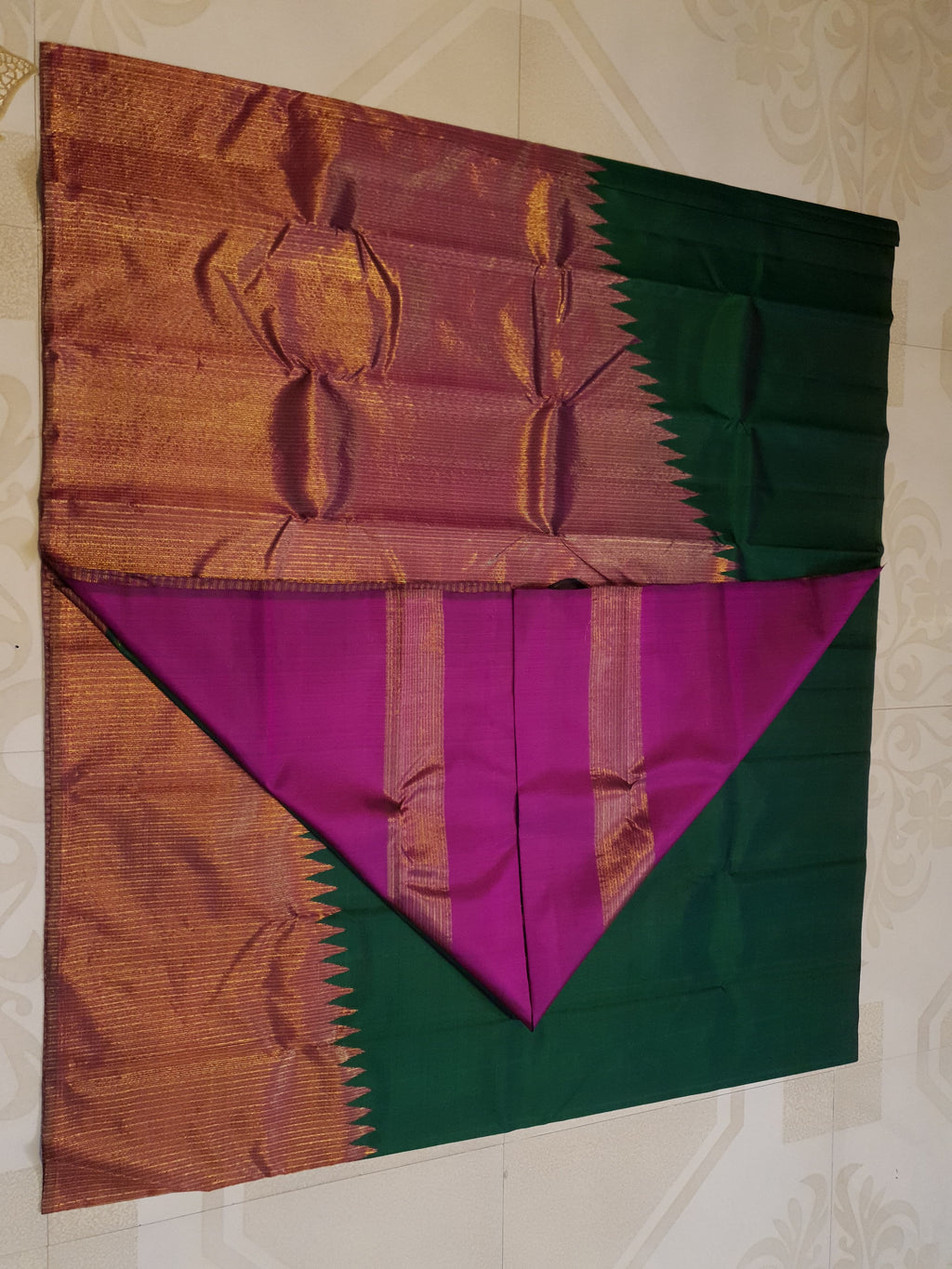 Bottle Green Kanchipuram handloom 2G gold temple silk saree featuring traditional gold zari weaving and classic temple borders.