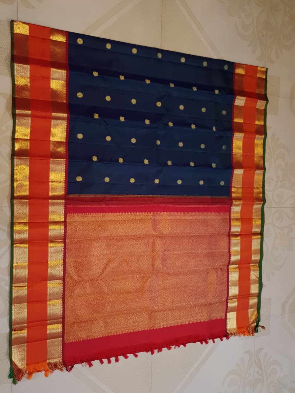 Midnight Blue Kanchipuram Handloom 2G Gold Korvai Silk Saree with contrasting orange gap borders and traditional motifs.