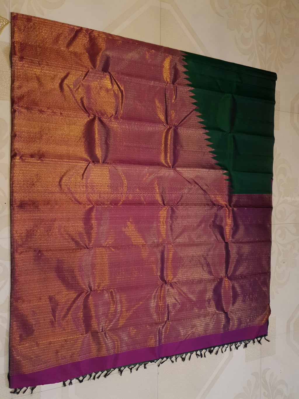 Bottle Green Kanchipuram handloom 2G gold temple silk saree featuring traditional gold zari weaving and classic temple borders.