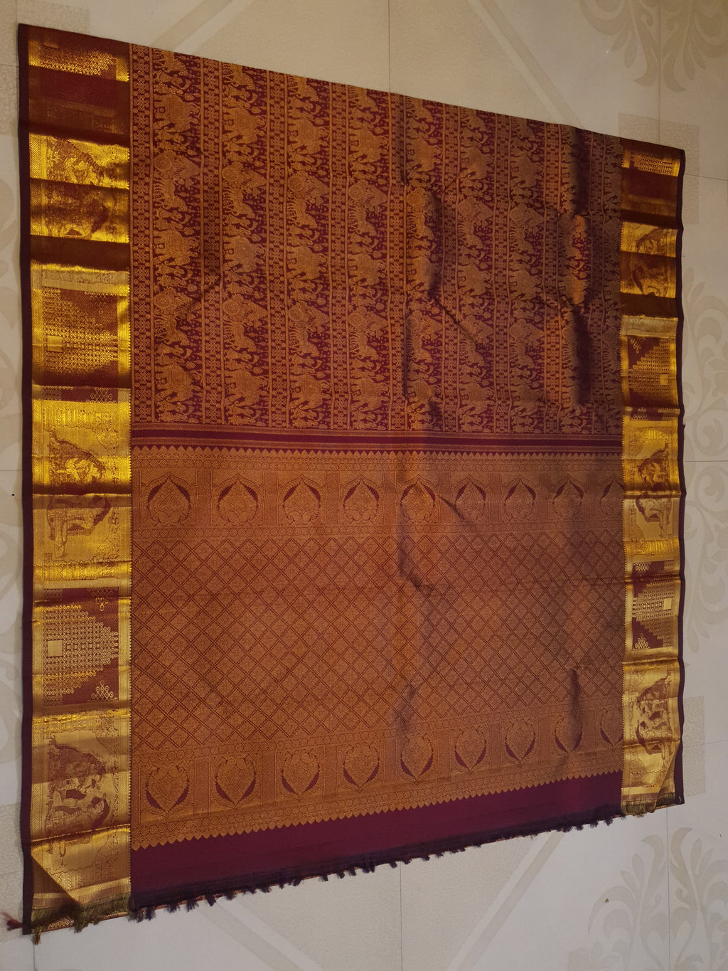 Rustic red Kanchipuram handloom 2G gold palaki design silk saree with rich gold zari weaving and traditional borders.